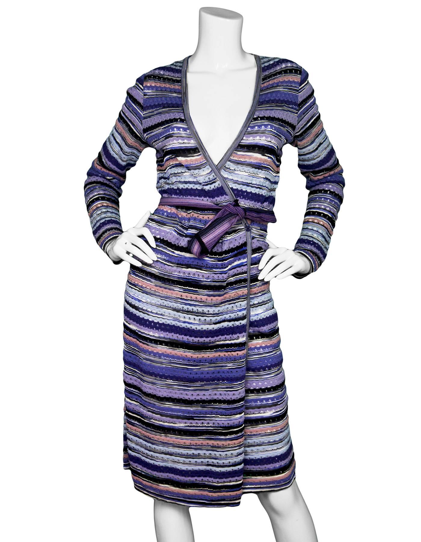 Missoni Purple Wrap Dress Sz IT46
Eyelet design - missing slip

Made In: Italy
Color: Purple
Composition: 55% wool, 40% rayon, 5% nylon
Lining: None
Closure/Opening: Button at waist
Overall Condition: Excellent pre-owned condition, gentle wear