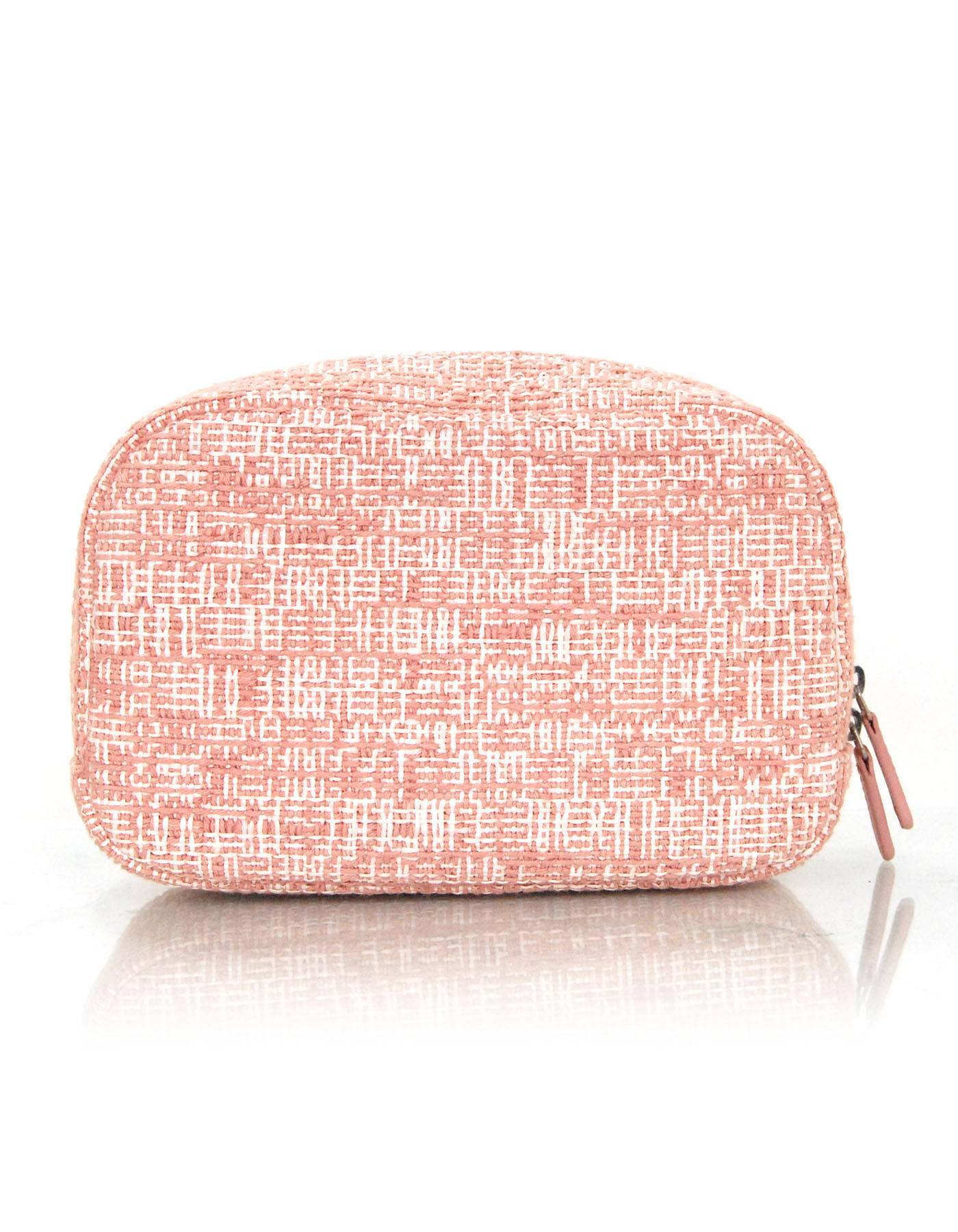 Chanel Pink Cruise Deauville Zip O-Case Travel Pouch
Features glitter chanel logo at front

Made In: Italy
Year of Production: 2018
Color: Pink
Hardware: Silvertone
Materials: Woven canvas
Lining: Pink textile
Closure/Opening: Double zip top