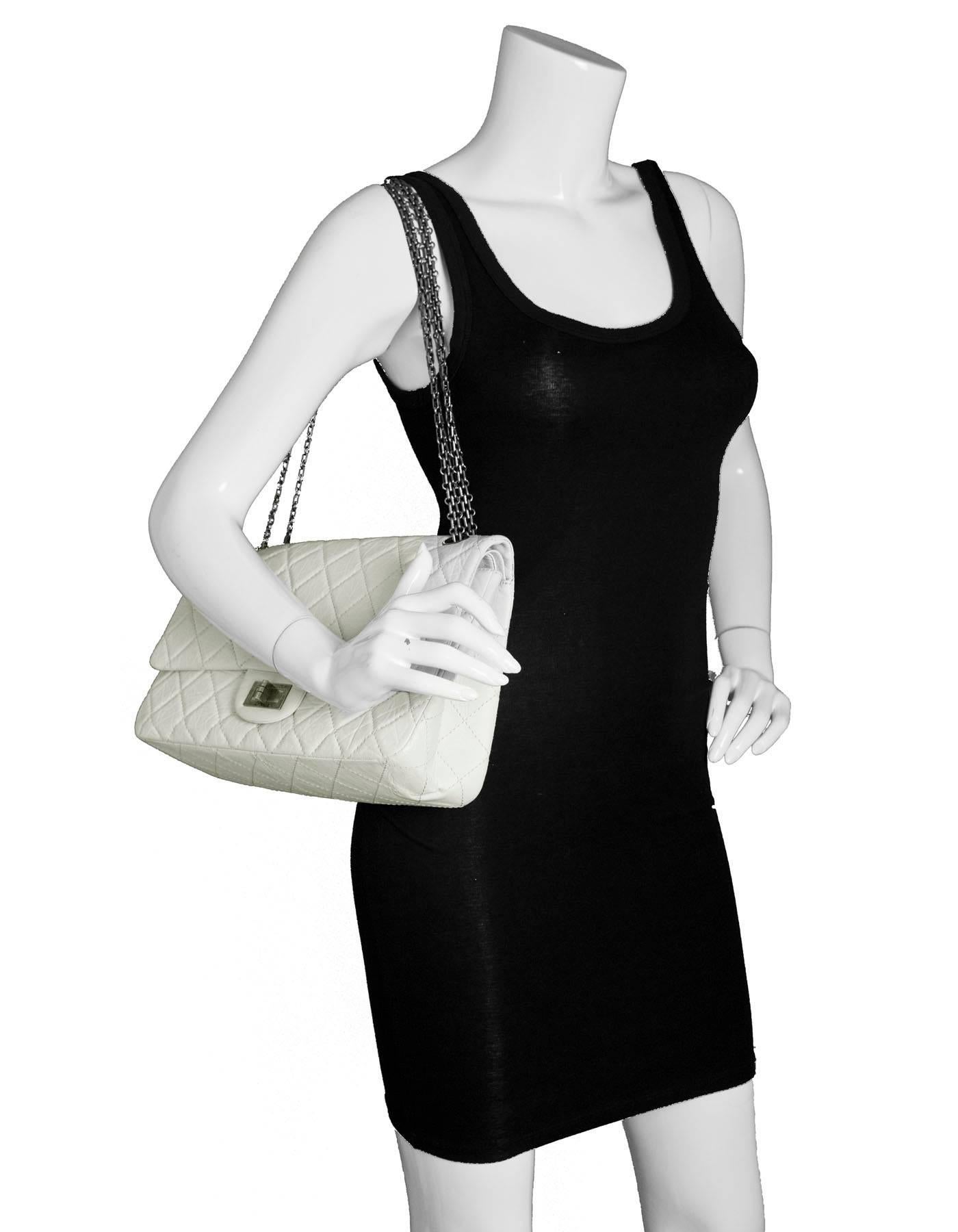 Chanel Ivory Quilted Calfskin 2.55 Reissue 227 Jumbo Double Flap Bag
Features antiqued silvertone madomoiselle chain strap and re-issue rectangular twist lock with CHANEL engraved

Made in: Italy
Year of Production: 2008-2009
Color: Ivory
Hardware: