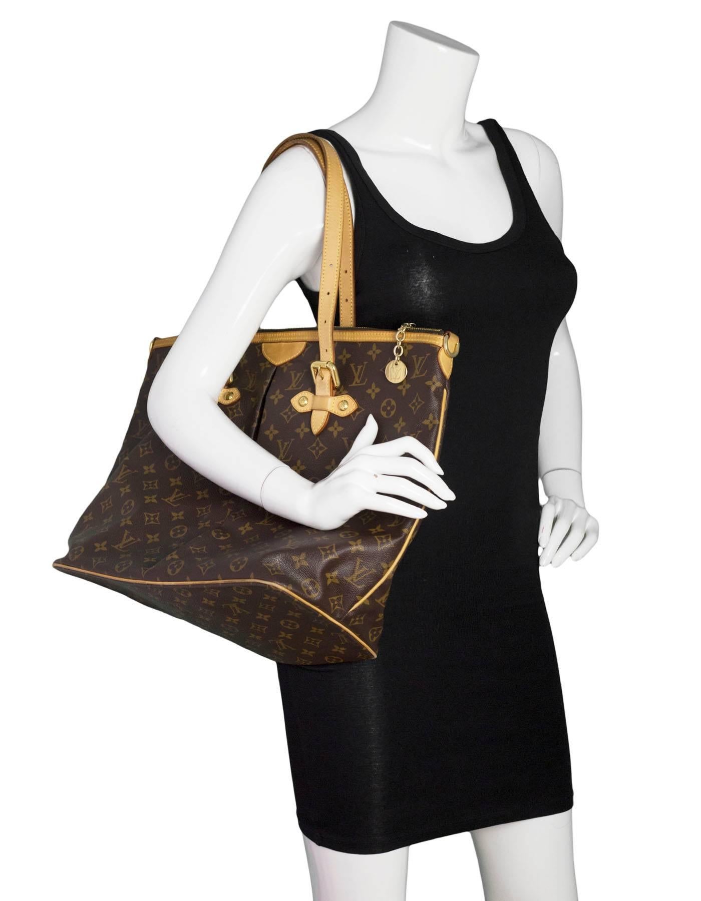 Louis Vuitton Monogram Palermo GM Tote

Made In: USA
Year of Production: 2007
Color: Brown, tan
Hardware: Goldtone
Materials: Vachetta leather and coated canvas
Lining: Brown canvas
Closure/Opening: Zip top
Exterior Pockets: None
Interior Pockets: