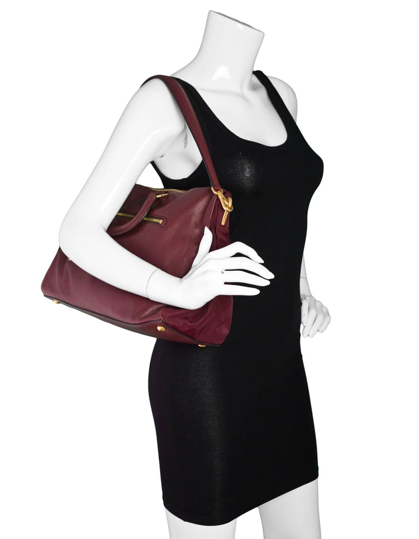 Prada Burgundy Tessuto & Saffiano Satchel Bag

Made In: Italy
Color: Burgundy
Materials: Leather, nylon, metal
Lining: Burgundy textile
Closure/Opening: Zip top
Exterior Pockets: Zip pocket at front and back
Interior Pockets: One zip pocket, one