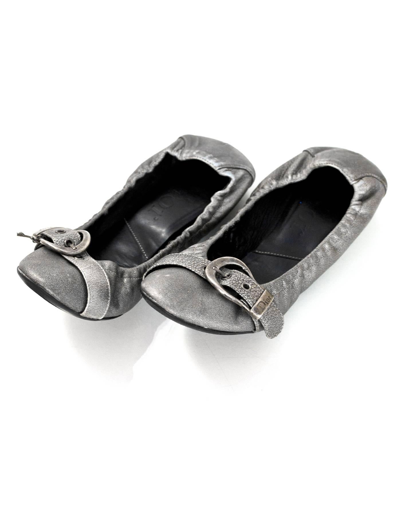 Christian Dior Silver Leather Stretch Flats Sz 37

Color: Silver
Materials: Leather
Closure/Opening: Slide on
Sole Stamp: Dior
Overall Condition: Excellent pre-owned condition with very light wear at out soles and insoles, some marks at heels and