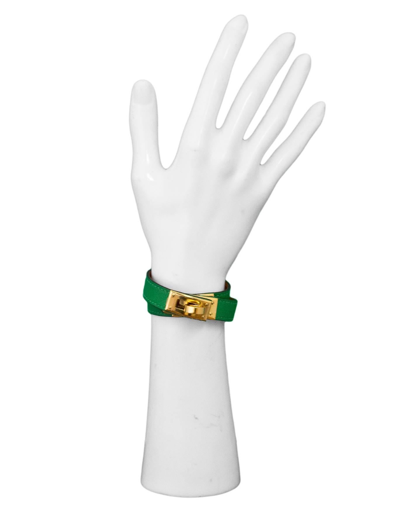 Hermes Green & Goldtone Kelly Double Tour Bracelet Sz XS 
Features Hermes classic twist lock closure with 