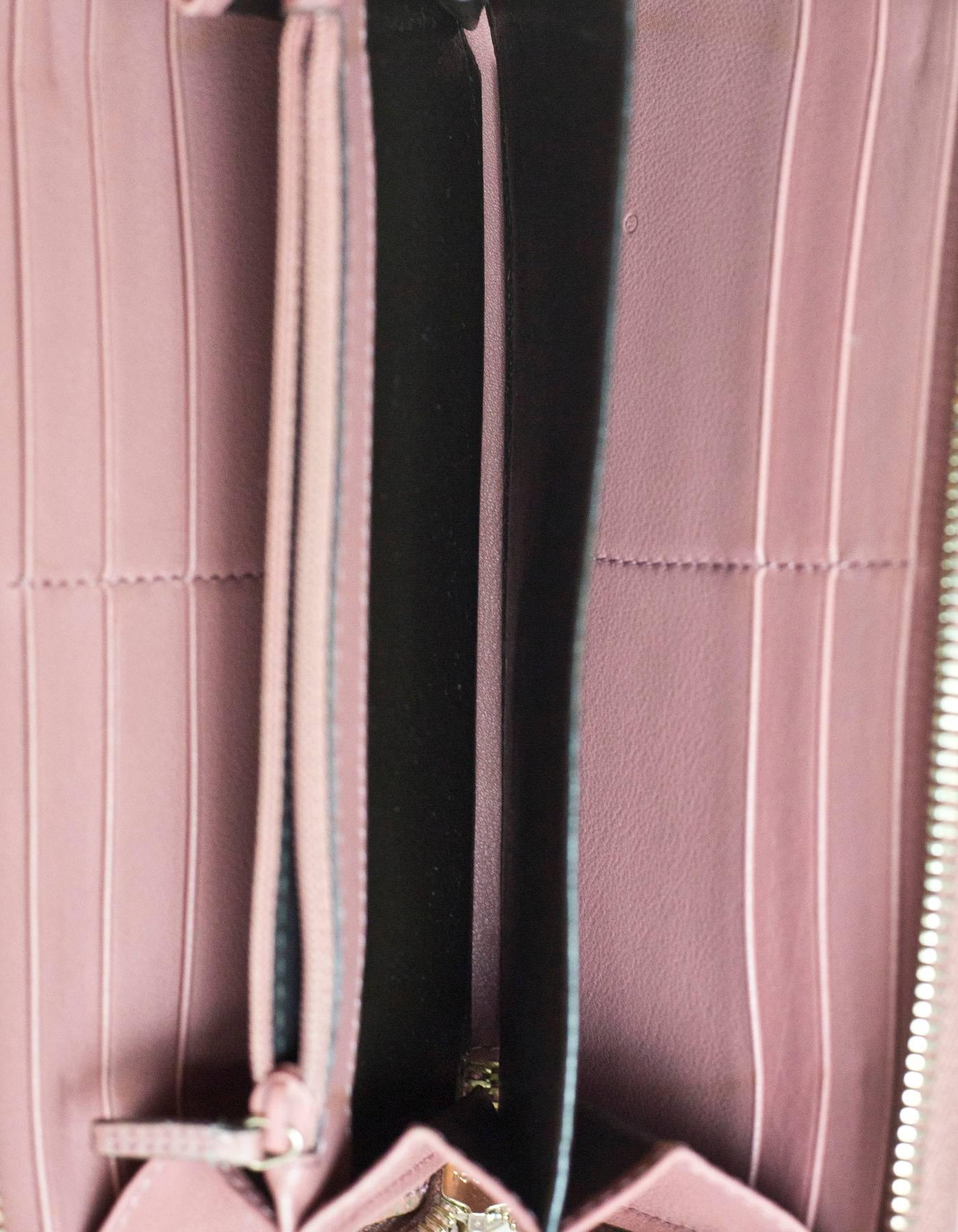 Gucci Pink Embossed Monogram Leather Zip Around Wristlet Wallet In Good Condition In New York, NY
