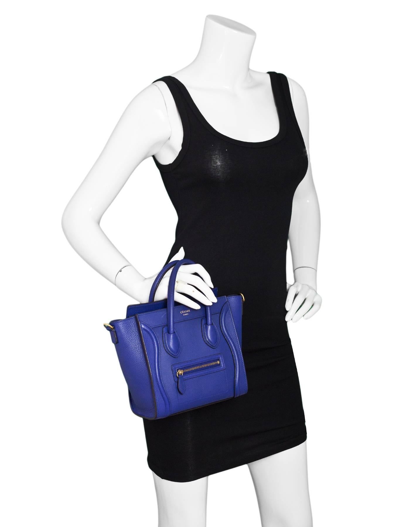 Celine Cobalt Blue Drummed Calfskin Nano Luggage Tote

Made In: Italy
Color: Cobalt blue
Hardware: Goldtone
Materials: Leather, metal
Lining: Blue suede
Closure/Opening: Zip top closure
Exterior Pockets: Front zip pocket
Interior Pockets: One wall