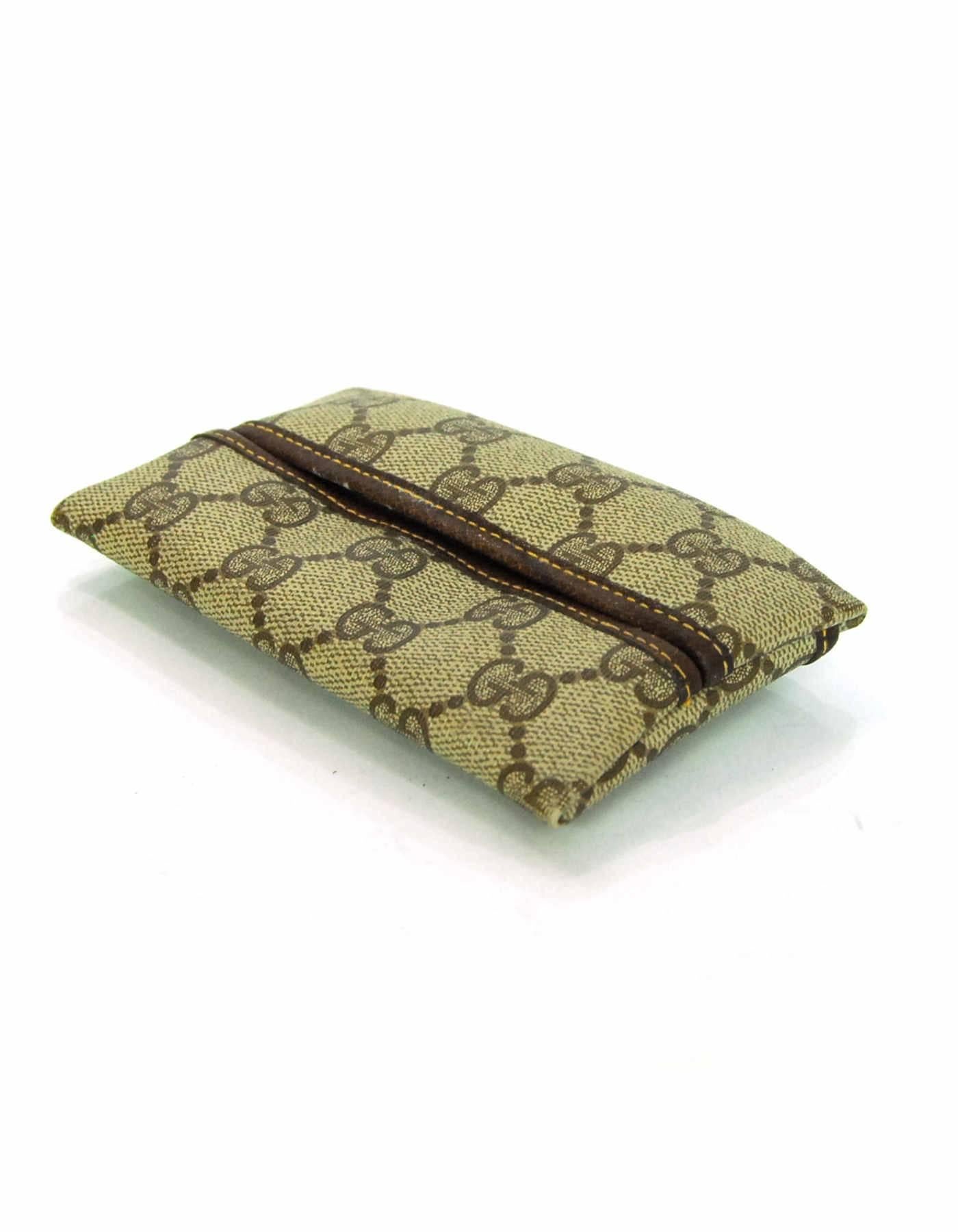 Gucci Vintage Tan Monogram Supreme Tissue Holder

Made In: Italy
Color: Tan, brown
Materials: Coated canvas, leather
Lining: Brown textile
Closure/Opening: Slit opening
Exterior Pockets: Flat pocket at back
Overall Condition: Very good vintage
