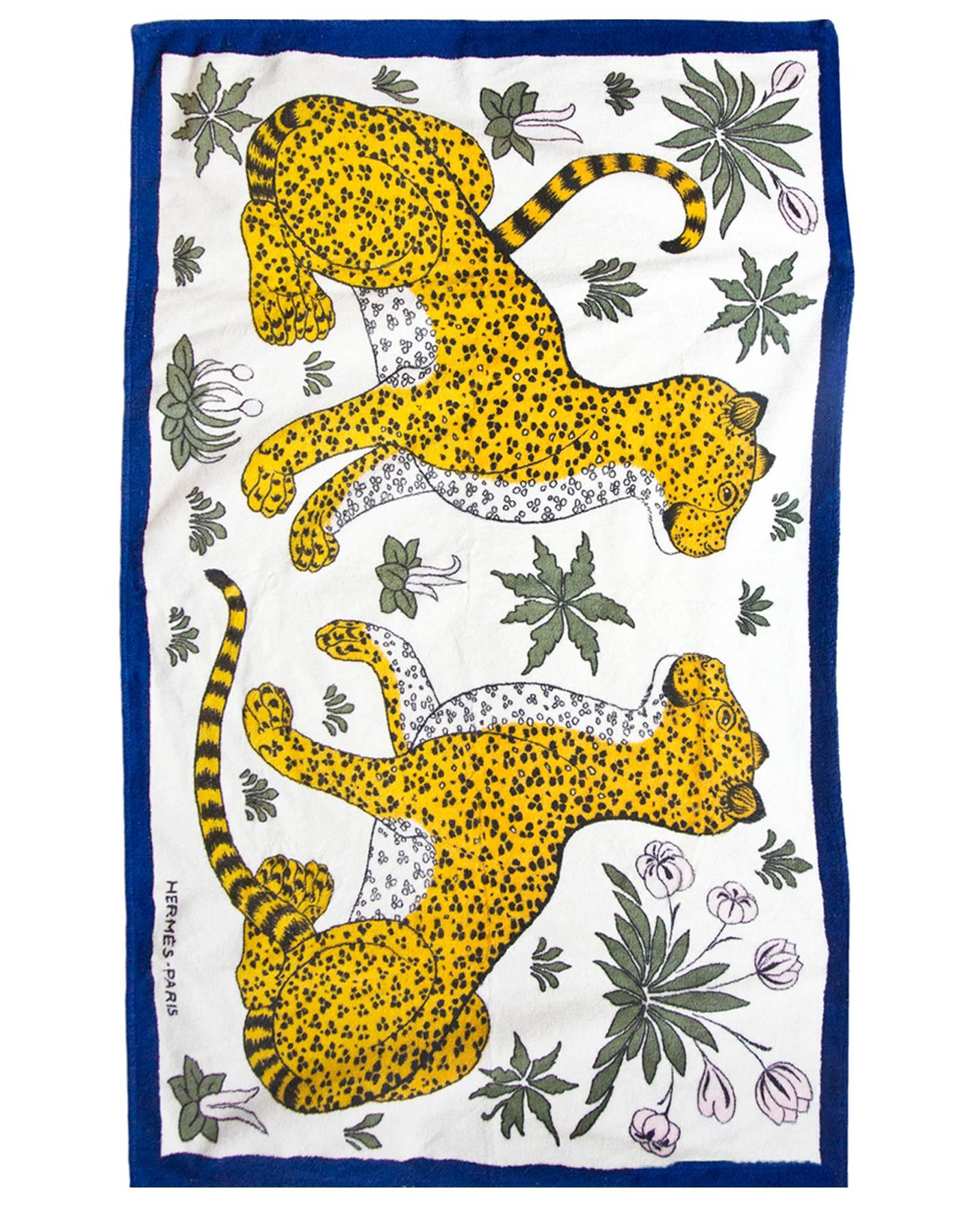 Hermes Blue Leopard Print Beach Towel

Made In: France
Color: Blue, yellow
Composition: 100% cotton
Retail Price: $600 + tax
Overall Condition: Excellent pre-owned condition, general fading

Measurements: 
Towel: 58