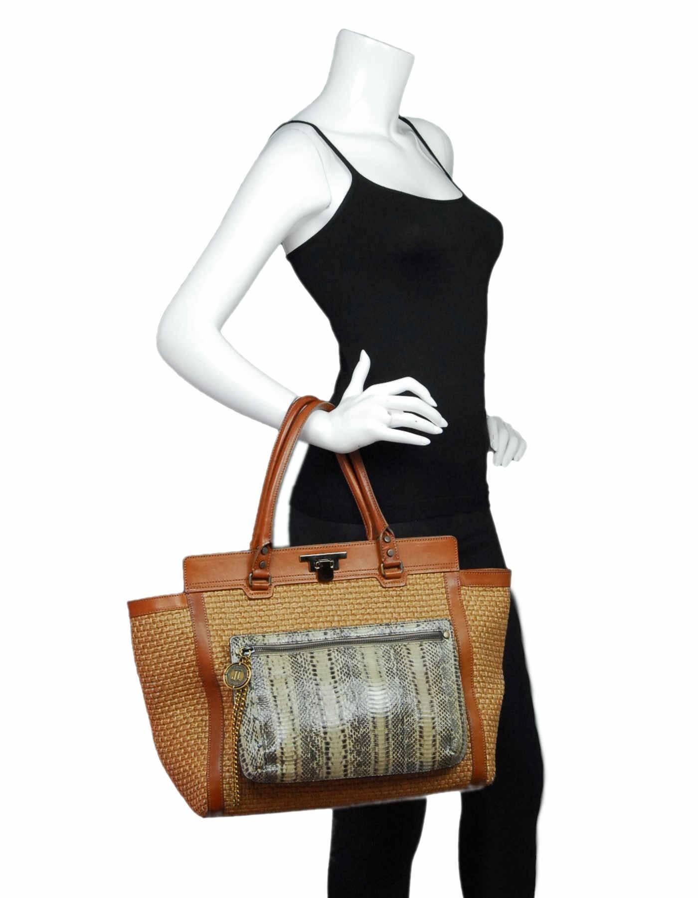 Lanvin Tan Woven Tote with Snakeskin Pouch

Made In: Italy
Color: Tan, brown, ivory
Hardware: Goldtone
Materials: Basket weave, leather, snakeskin, leather
Lining: Brown textile
Closure/Opening: Open top with side magneitc closures and center