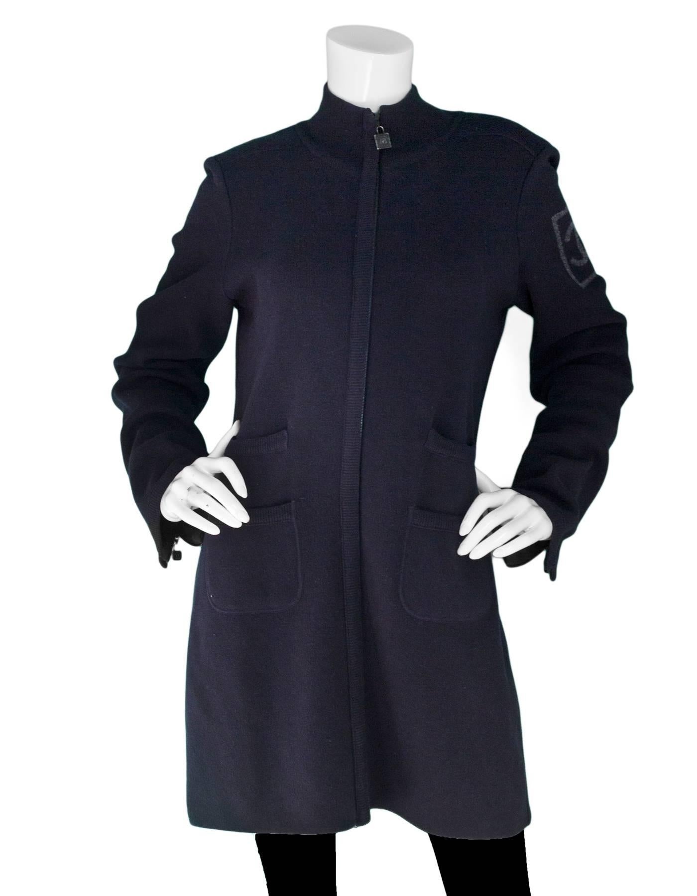Chanel Sport Navy Wool Long Sweater Coat Sz FR42

Made In: Italy
Year Of Production: 2008
Color: Navy
Materials: 100% Wool
Lining: None
Closure/Opening: Front zip closure
Exterior Pockets: Four slit pockets
Overall Condition: Excellent pre-owned