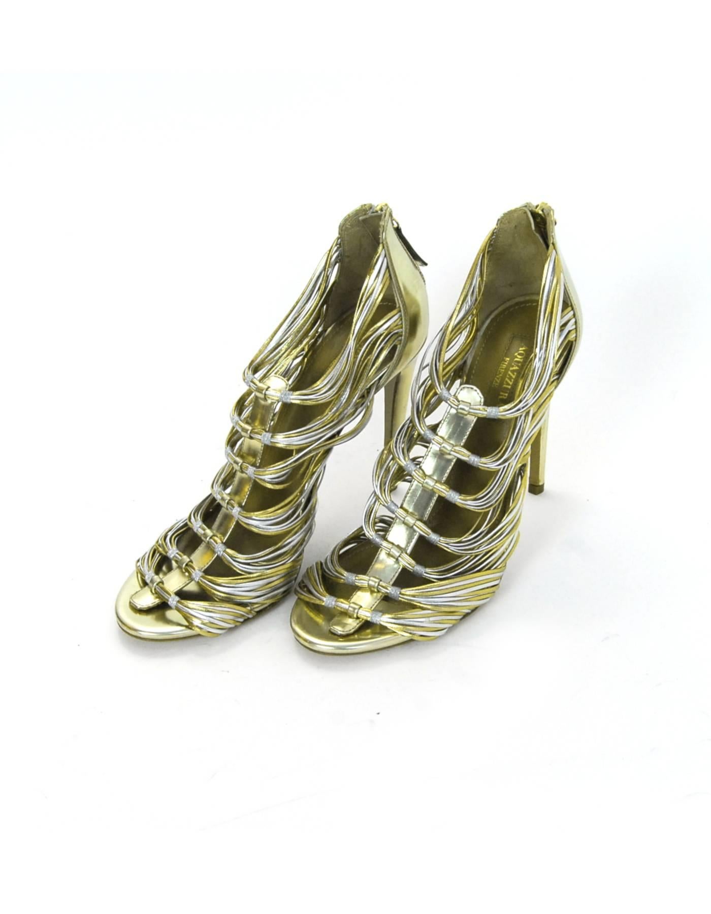 Aquazzura Gold & Silver Xena 105 Sandals Sz 37 NEW

Made In: Italy
Color: Gold, silver
Materials: Suede
Closure/Opening: Zip closure at back of heel
Sole Stamp: Aquazzura Firenze Vero Cuoio Made In Italy 37
Retail Price: $950 + tax
Overall