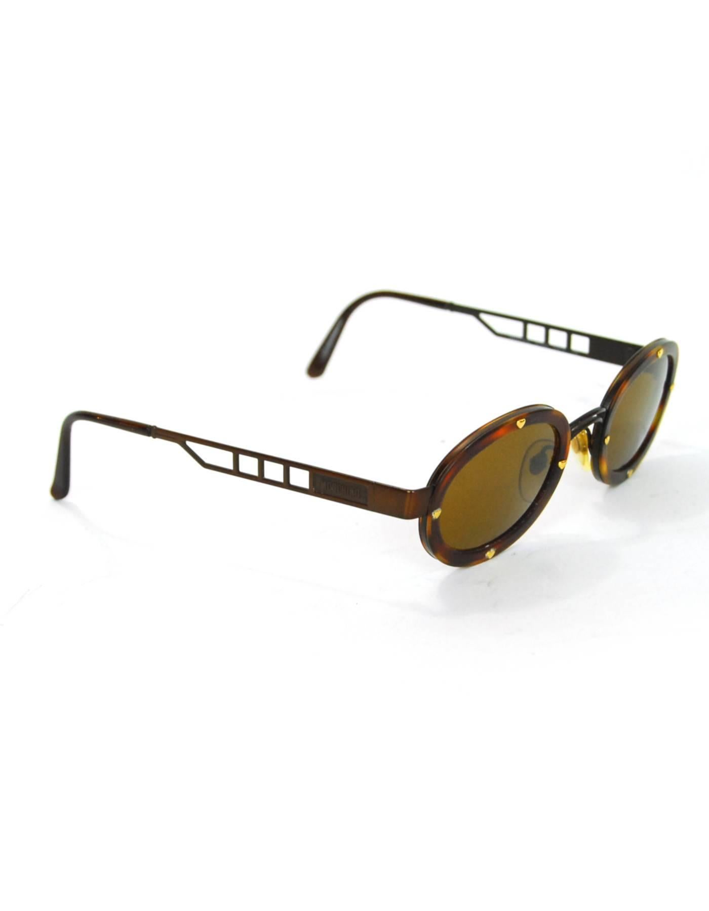 Moschino Vintage Brown Sunglasses
Features small goldtone hearts

Made In: Italy
Color: Brown
Materials: Resin, metal
Overall Condition: Excellent vintage pre-owned condition with the exception of some surface marks
Included: Moschino
