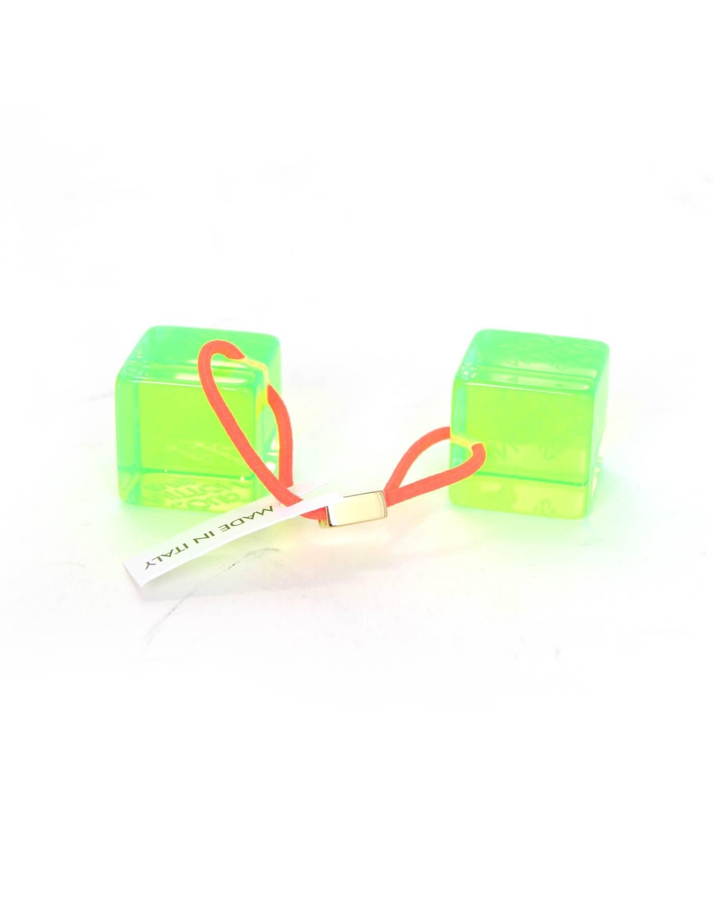 Louis Vuitton Green Lucite Hair Cubes

Made In: Italy
Color: Green
Hardware: Goldtone
Materials: Lucite, brass, elasticized band
Retail Price: $295 + tax
Overall Condition: Excellent pre-owned condition
Measurements: 
1