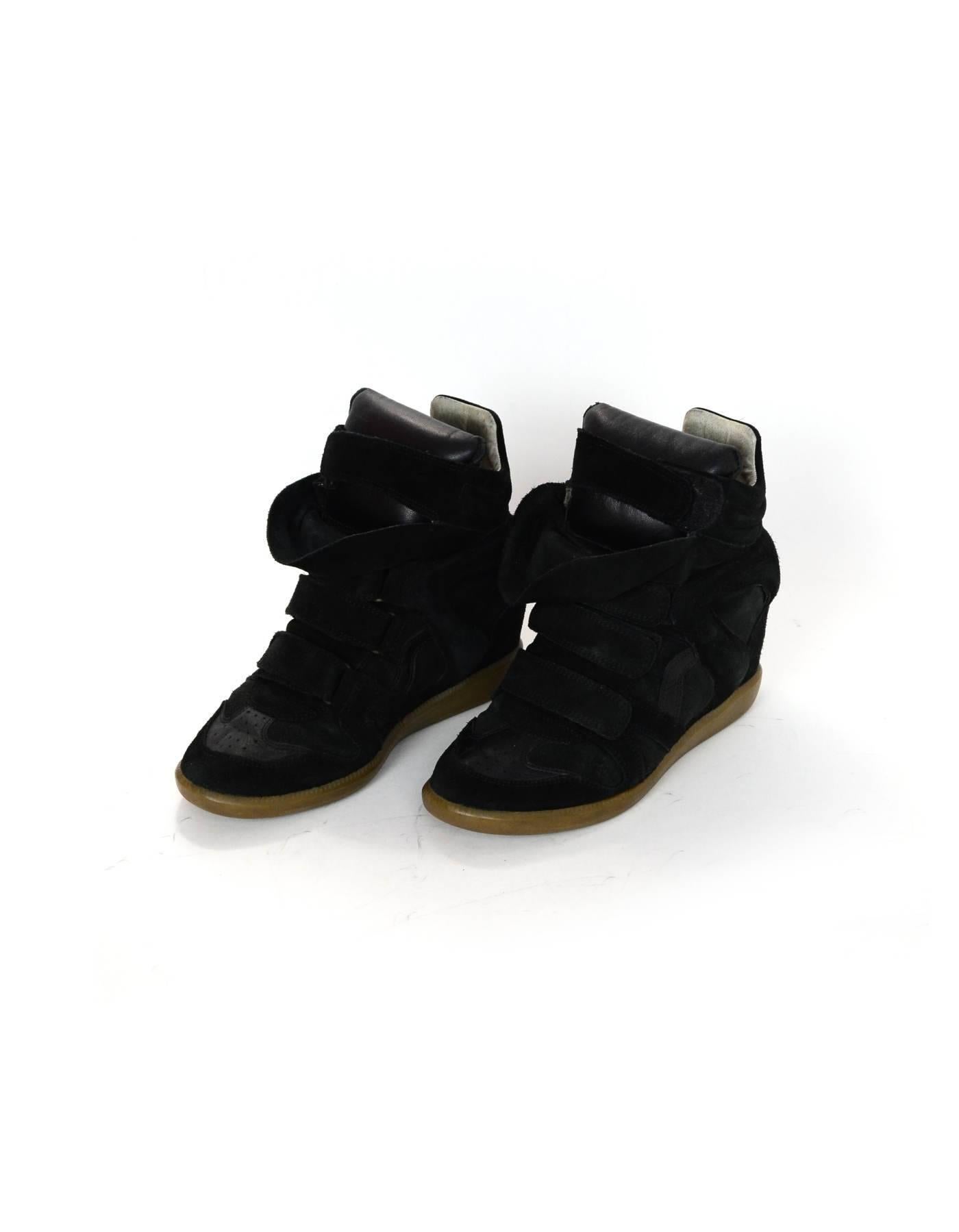 Isabel Black Leather & Suede Beckett Sneakers Sz 39

Color: Black
Materials: Leather, suede
Closure/Opening: Velcro closure
Sole Stamp: Isabel Marant 39
Retail Price: $695+ tax
Overall Condition: Very good pre-owned condition with the exception of