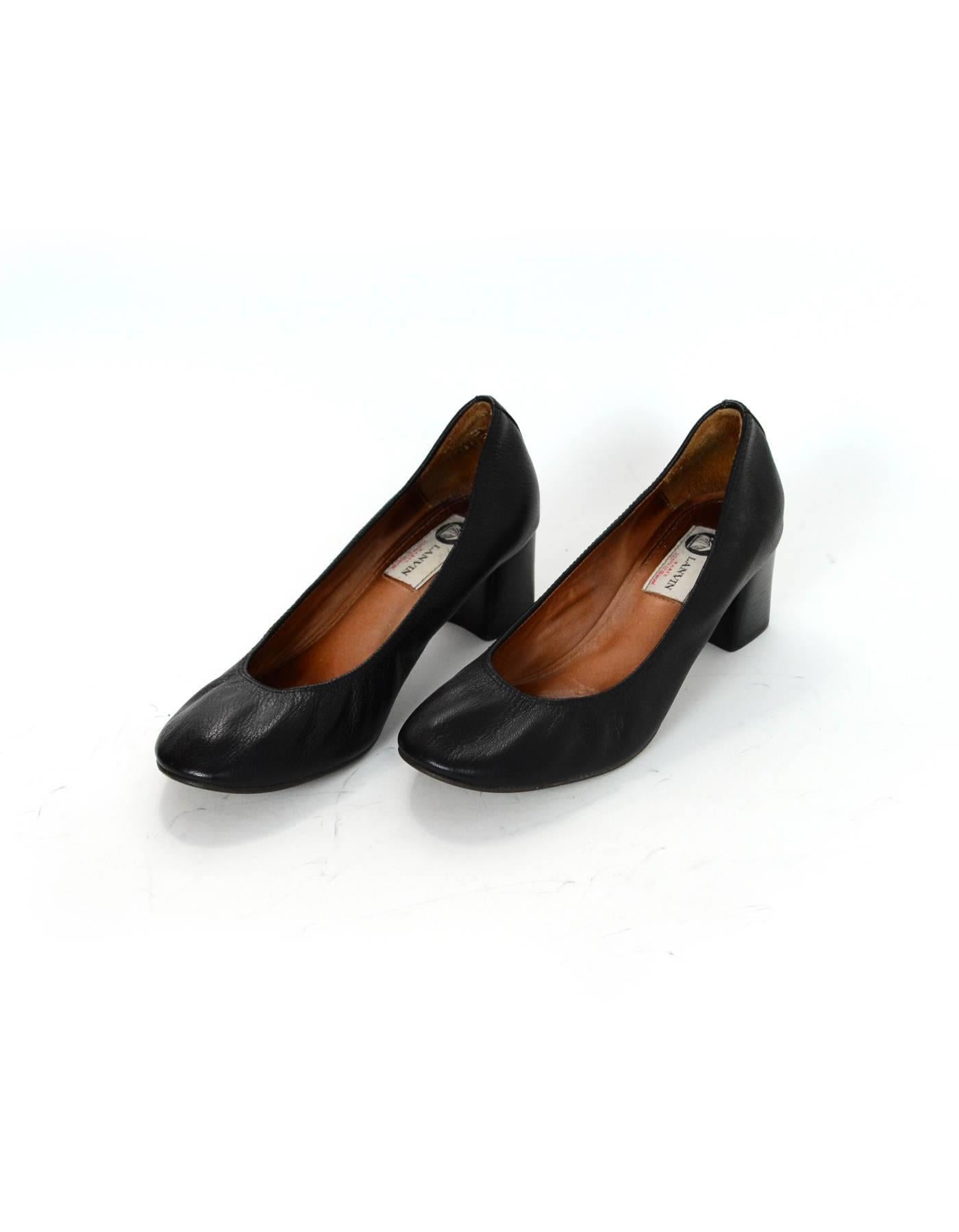 Lanvin Black Leather Pumps Sz 39

Made In: Portugal
Color: Black
Materials: Leather
Closure/Opening: Slide on
Sole Stamp: Lanvin 39
Overall Condition: Excellent pre-owned with the exception of some scuffing at heels, wear at insoles and