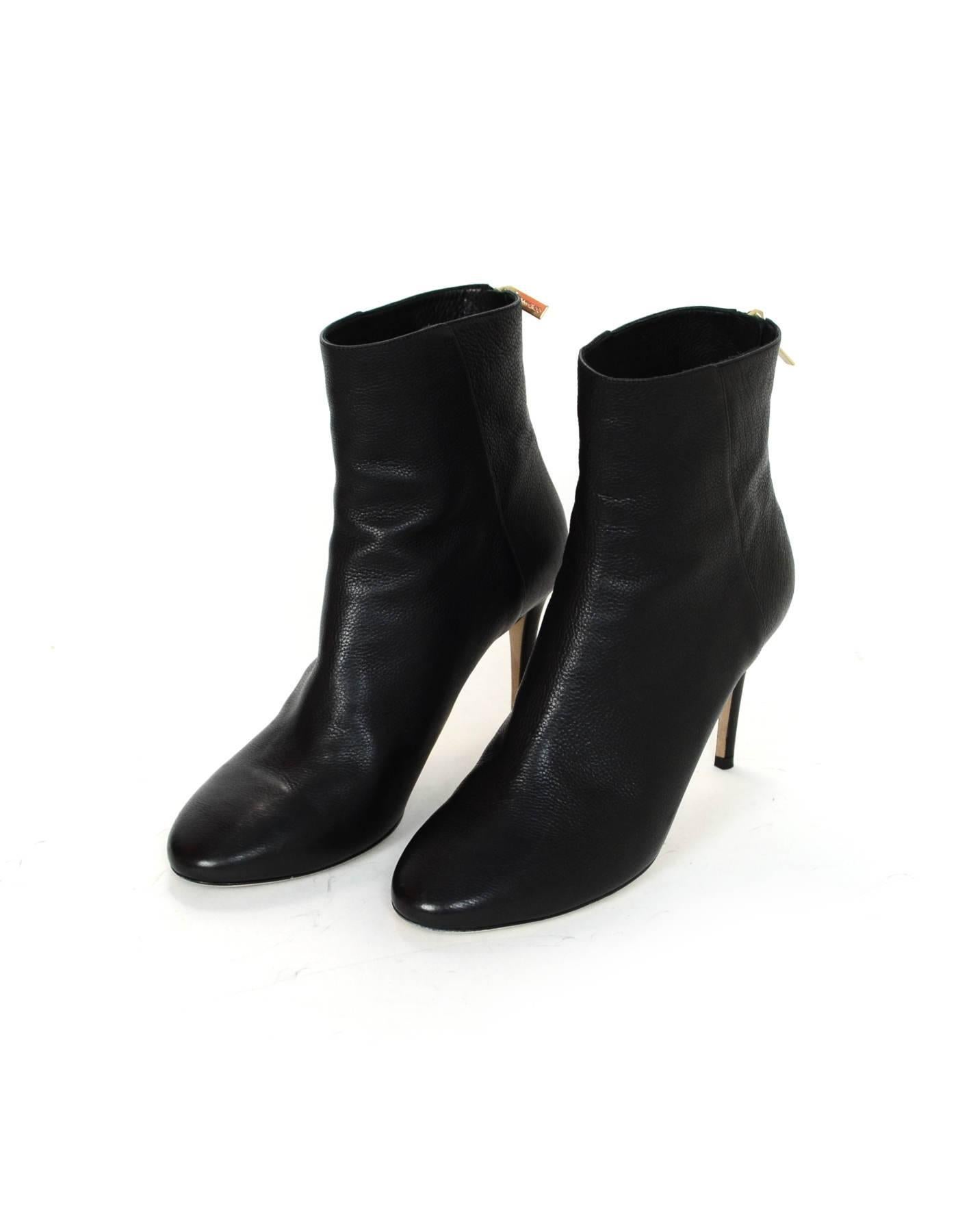 Jimmy Choo Black Leather Duke 85 Ankle Boots Sz 38

Made In: Italy
Color: Black
Materials: Leather
Closure/Opening: Zip closure at back of ankle
Sole Stamp: Jimmy Choo London Made in Italy 38
Retail Price: $895 + tax
Overall Condition: Excellent