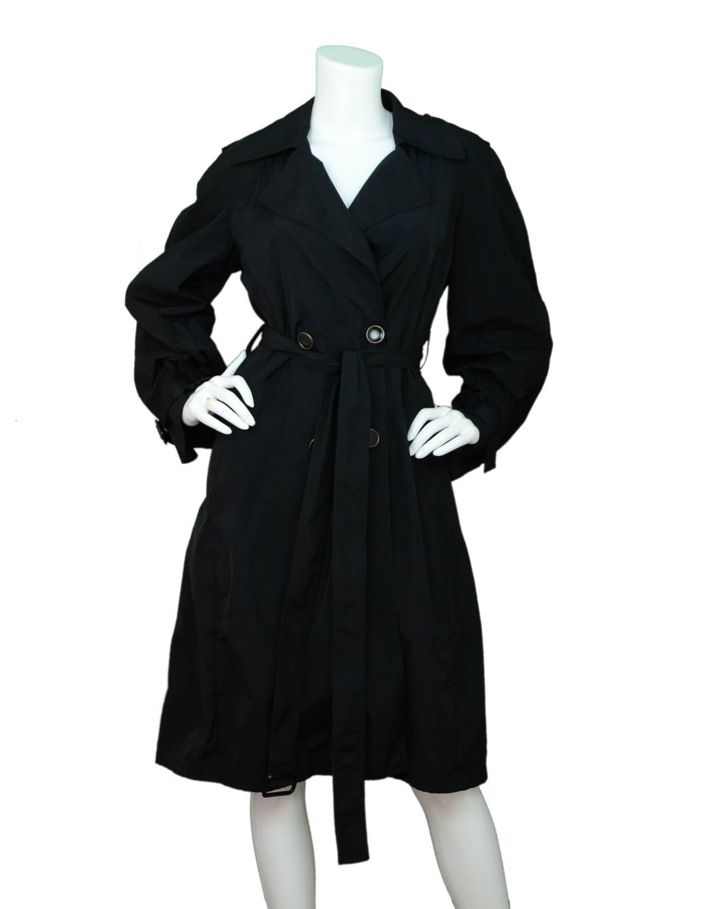 Stella McCartney Black Trench Coat Sz IT40

Features pleated vent at back

Made In: Italy
Color: Black
Composition: 100% polyester
Lining: None
Closure/Opening: Double breasted button closure
Exterior Pockets: Two slit pockets
Overall Condition: