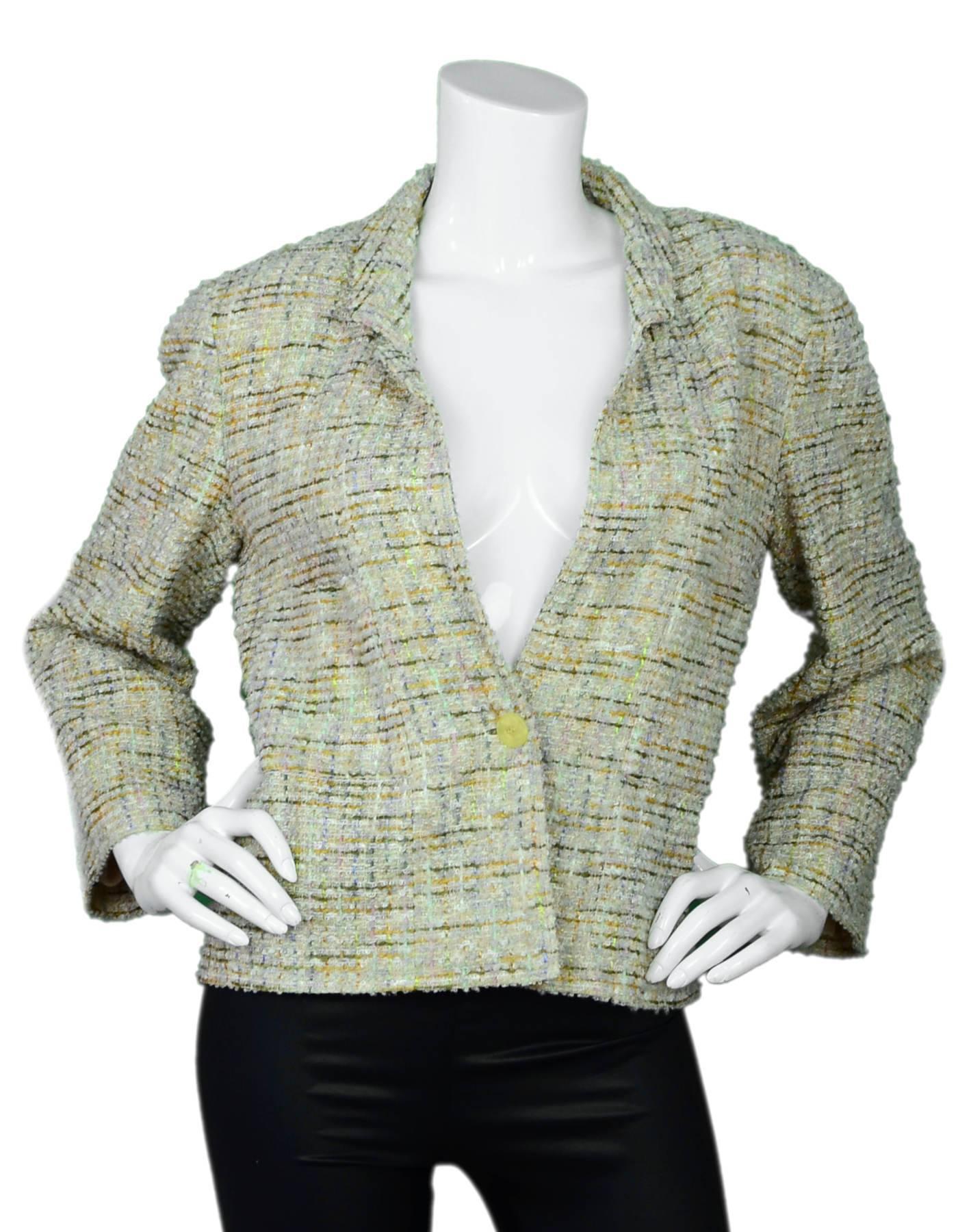 Chanel Beige & Multi-Colored Tweed Jacket Sz FR42

Made In: France
Color: Beige, multi
Year Of Production: 1999
Composition: 42% polyester, 34% wool, 16% rayon, 6% acrylic, 2% cotton
Lining: Nude mesh
Closure/Opening: Front single button