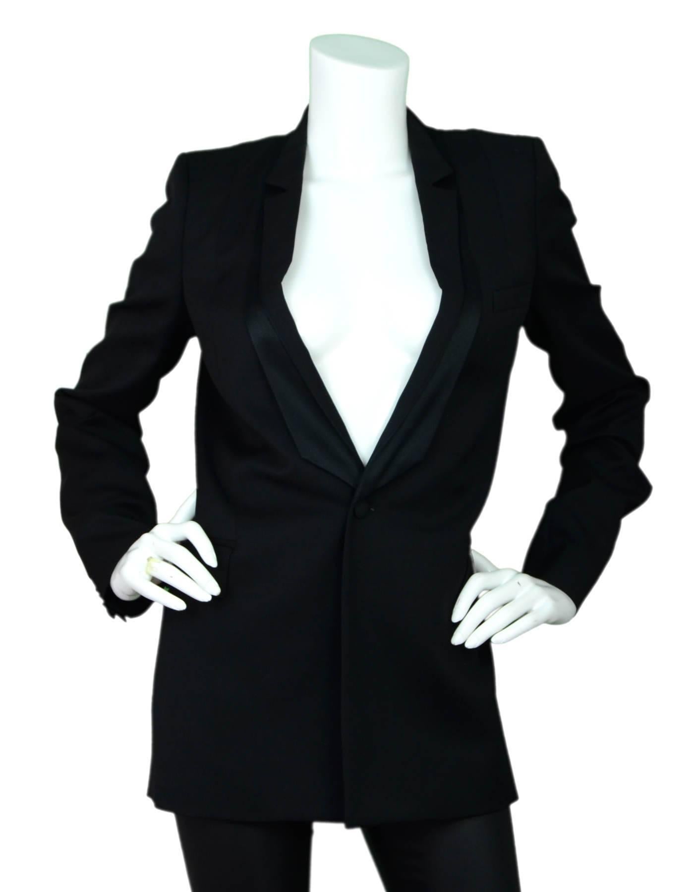 Givenchy Black Wool Blazer Sz FR36

Made In: Italy
Color: Black
Composition: 100% Wool
Lining: Black textile
Closure/Opening: Front single button closure
Overall Condition: Excellent pre-owned condition, some wear and staining at interior
