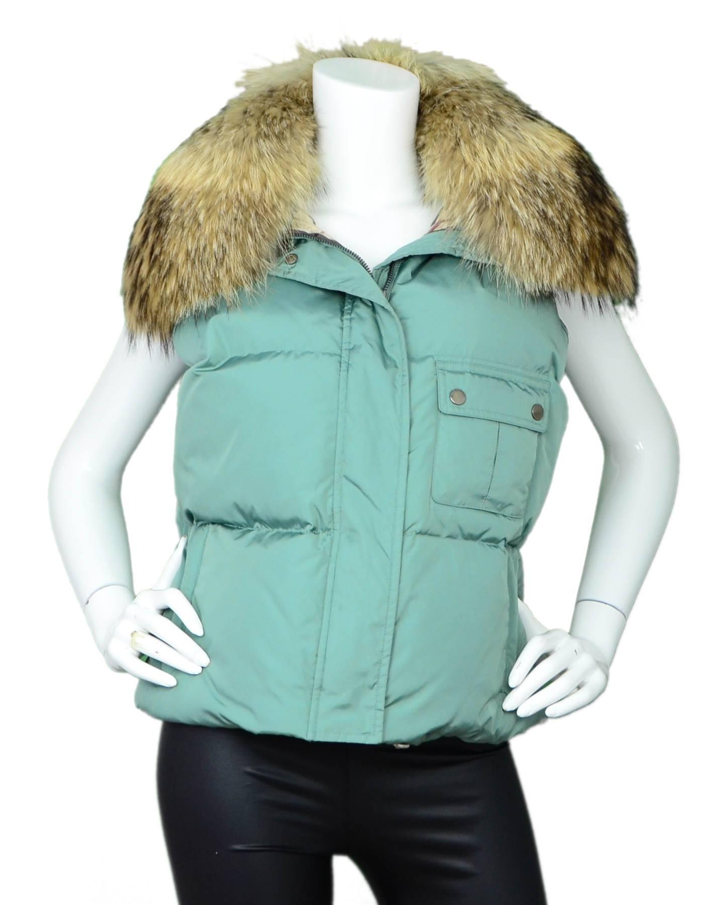 Burberry Seafoam Green Vest with Raccoon Collar Sz L

Fur collar can be removed

Made In: China
Color: Seafoam green
Composition: 97% nylon, 3% polyururethane
Closure/Opening: Front zip and button closure
Exterior Pockets: Side zip pockets and snap