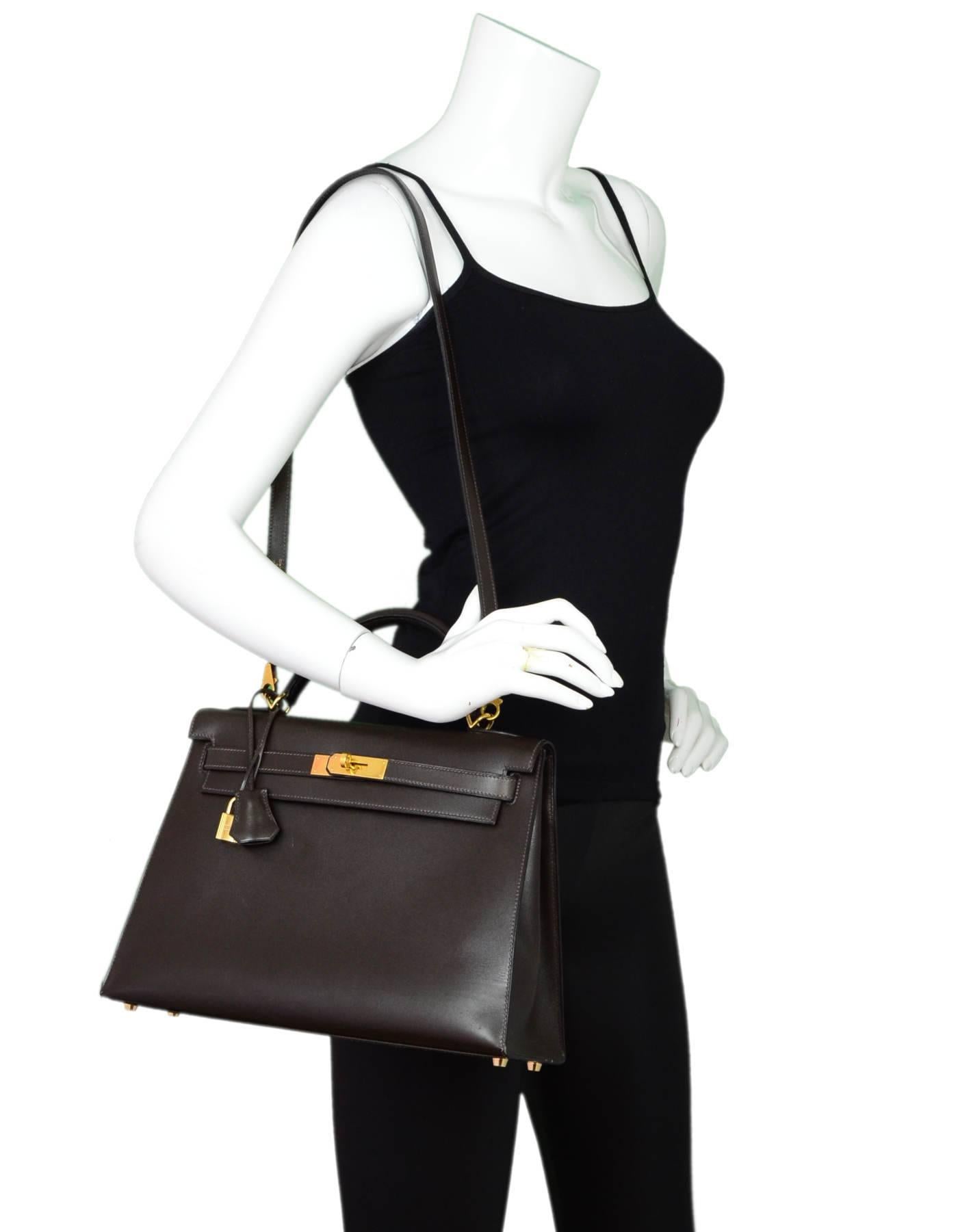 Hermes Brown Box Leather Sellier Rigid Kelly 32cm Bag 
Features removable shoulder/crossbody strap

Made In: France
Year of Production: 2000
Color: Brown
Hardware: Goldtone
Materials: Box leather, metal
Lining: Brown leather
Closure/opening: Flap