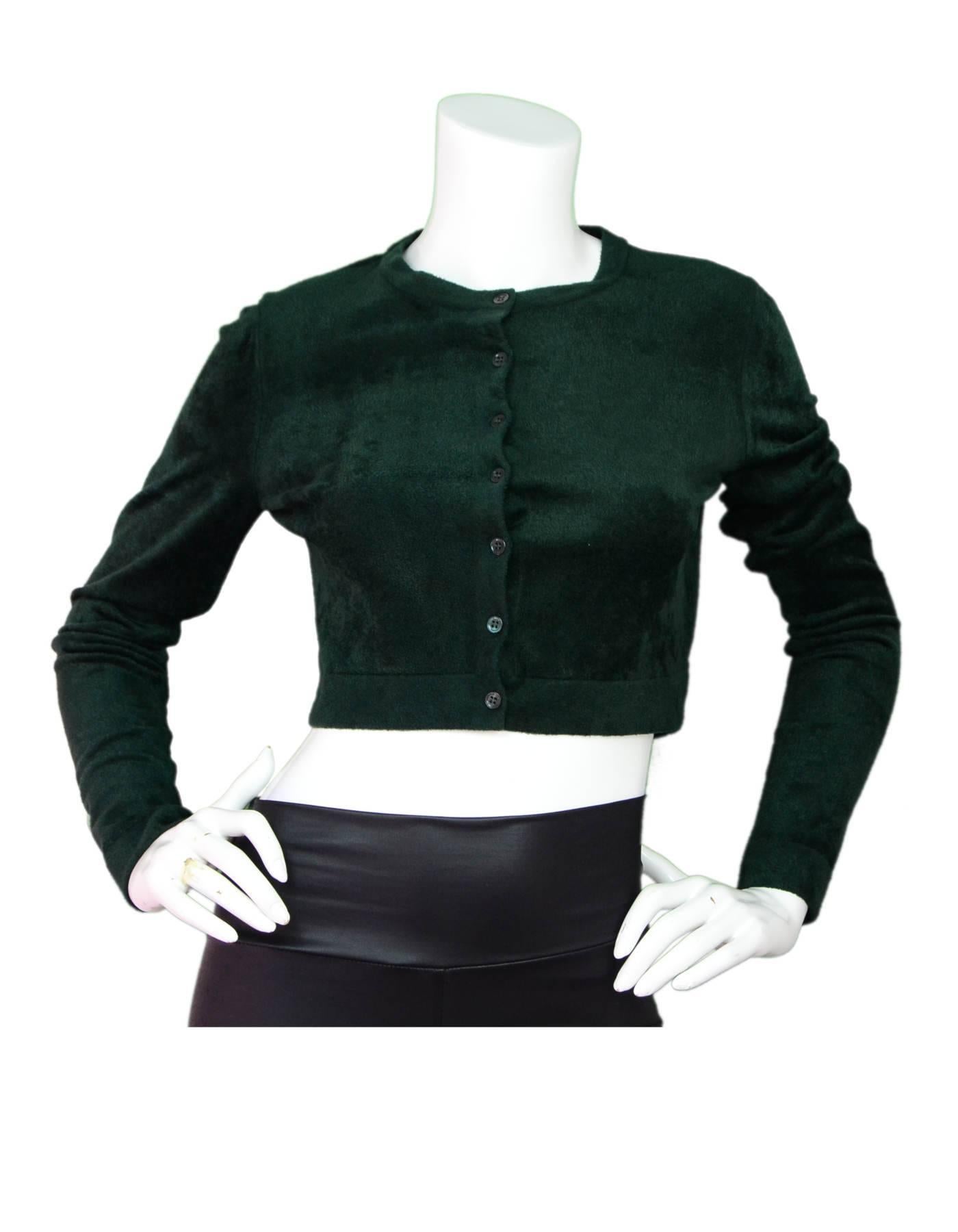 Alaia Green Velvet Cropped Cardigan Sz FR40

Made In: Italy
Color: Green
Composition: 63% viscose, 37% nylon
Lining: None
Closure/Opening: Front button closure
Exterior Pockets: None
Interior Pockets: None
Overall Condition: Excellent pre-owned