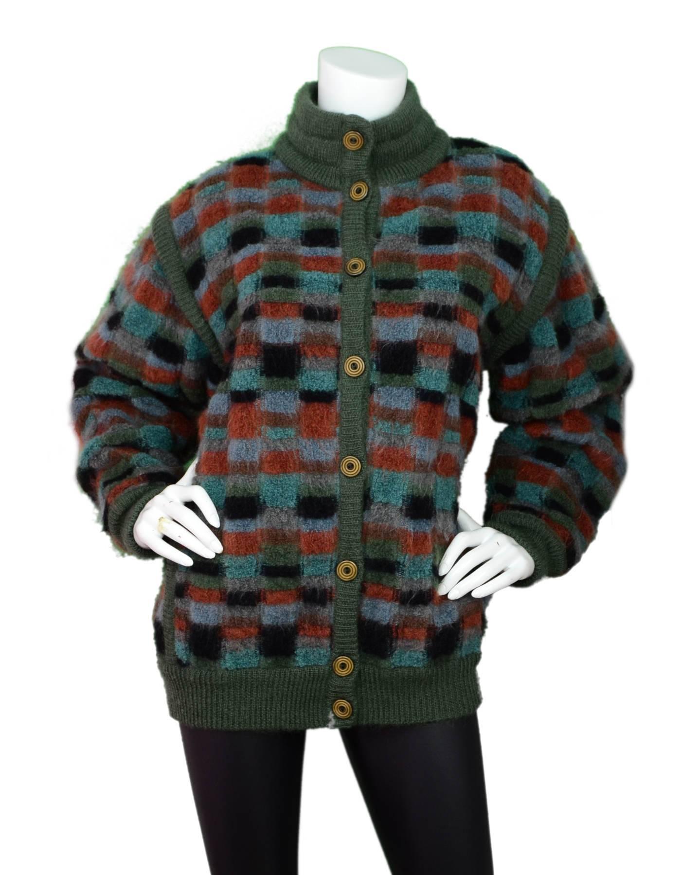Missoni Multicolor Reversible Sweater Jacket

Made In: Italy
Color: Green, blue, black, tan, grey
Composition: Not listed, feels like wool blend
Lining: Reversible
Closure/Opening: Button closure
Exterior Pockets: Slit pockets / flap pockets
Overall