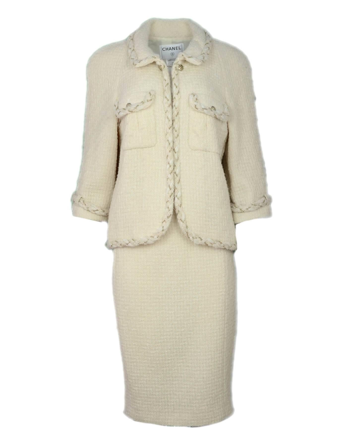 Chanel Cream Wool Jacket Sz FR46
Features goldtone woven chain-link trim

Made In: France
Year of Production: 2007
Color: Cream
Composition: 100% wool
Lining: Beige, 100% silk
Closure/Opening: Neckline button and hook and eye closure
Exterior