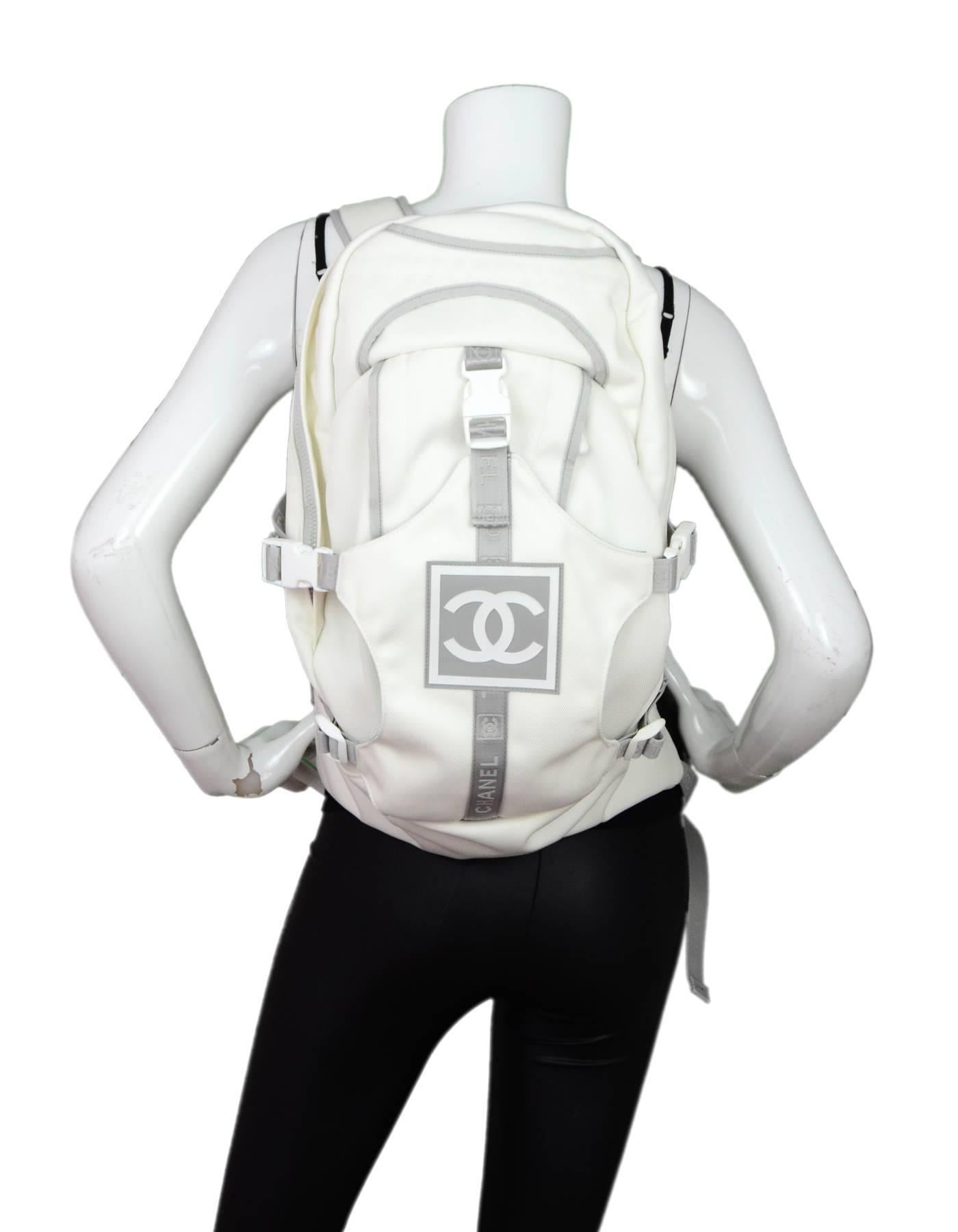 Chanel Sport White CC Canvas Backpack

Made In: Italy
Color: White, grey
Hardware: White
Materials: Canvas, rubber
Lining: Grey textile
Closure/Opening: Double zip top
Exterior Pockets: Front buckle area, zip pocket
Interior Pockets: Zip wall