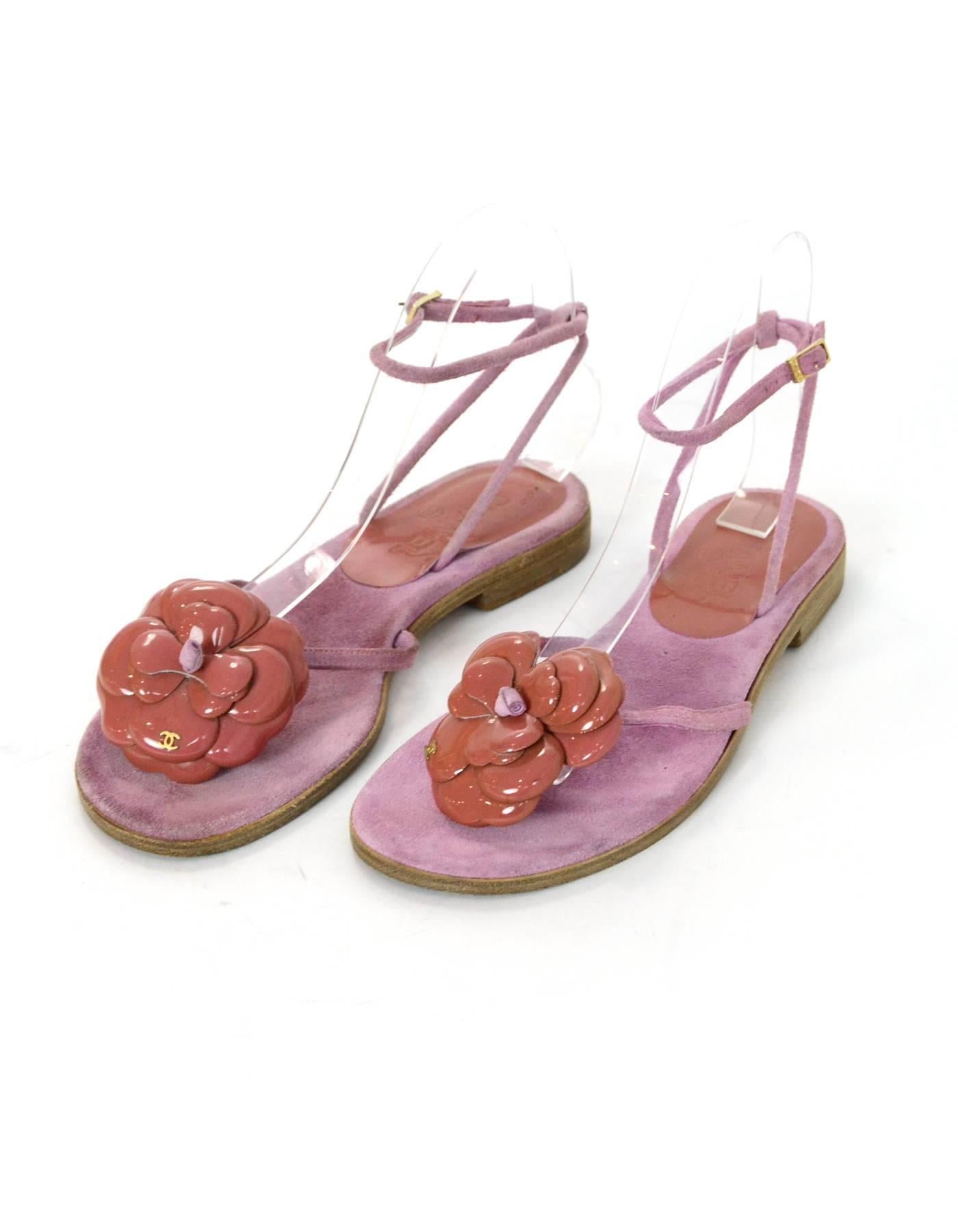 Chanel Pink Suede Camellia Sandals Sz 37.5

Made In: Italy
Color: Pink
Materials: Suede
Closure/Opening: Buckle closure at ankle
Sole Stamp: CC Made in Italy 37.5
Overall Condition: Very good pre-owned condition with the exception of wear at