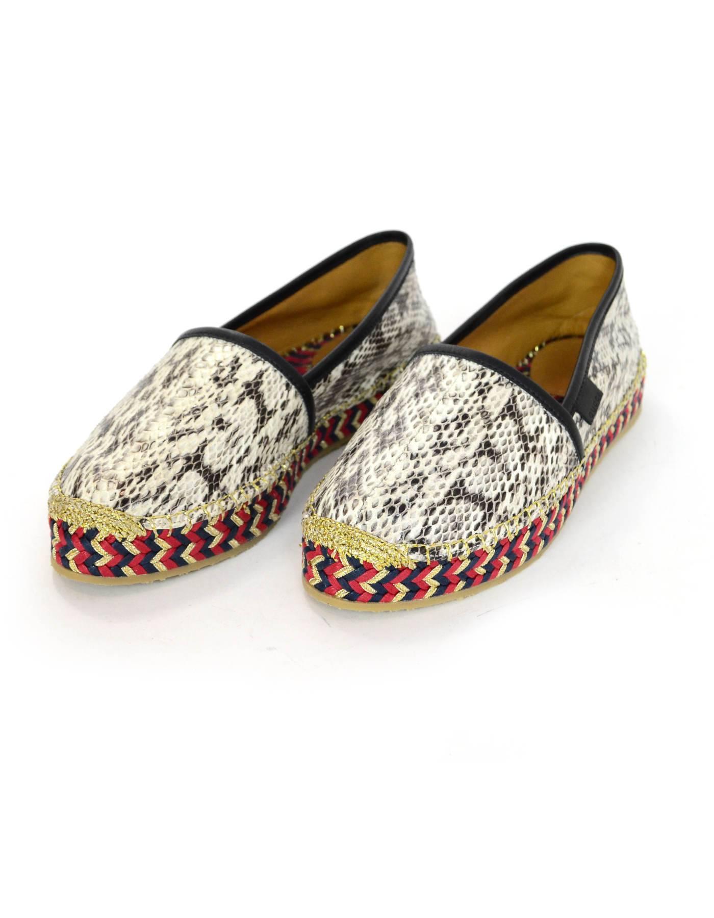 Gucci Snakeskin Pilar Espadrilles Sz 36.5 NIB

Features red, navy & gold braided platform

Made In: Spain
Color: Black, white, red, gold
Materials: Snakeskin, leather
Closure/Opening: Slide on
Sole Stamp: Gucci Made in Spain
Overall Condition:
