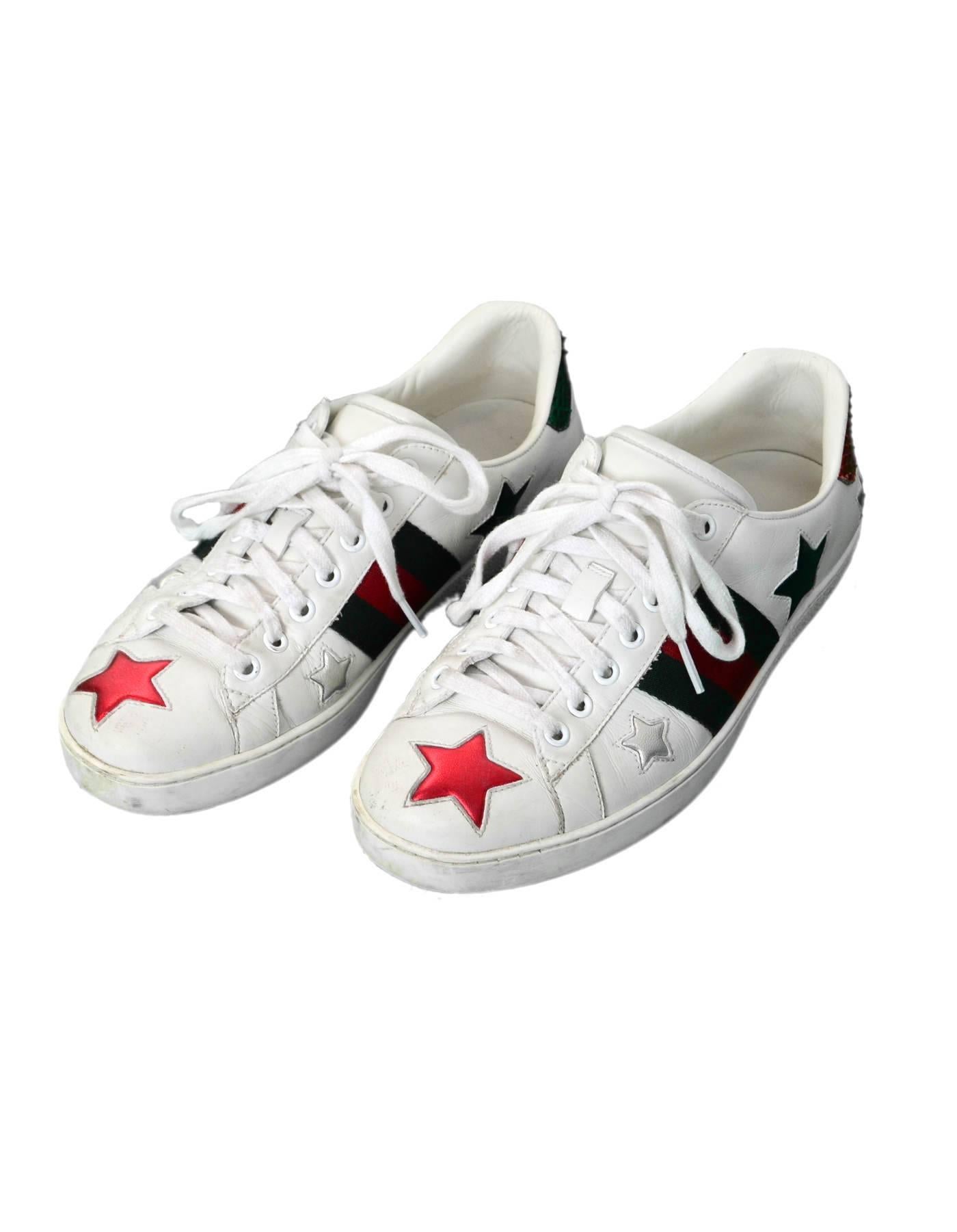 Gucci Men's Ace White Leather & Metallic Star Sneakers Sz 7.5

Made In: Italy
Color: White, red, silver, gold, green
Materials: Leather, canvas
Closure/Opening: Lace tie closure
Sole Stamp: Gucci Made in Italy
Retail Price: $670 + Tax
Overall