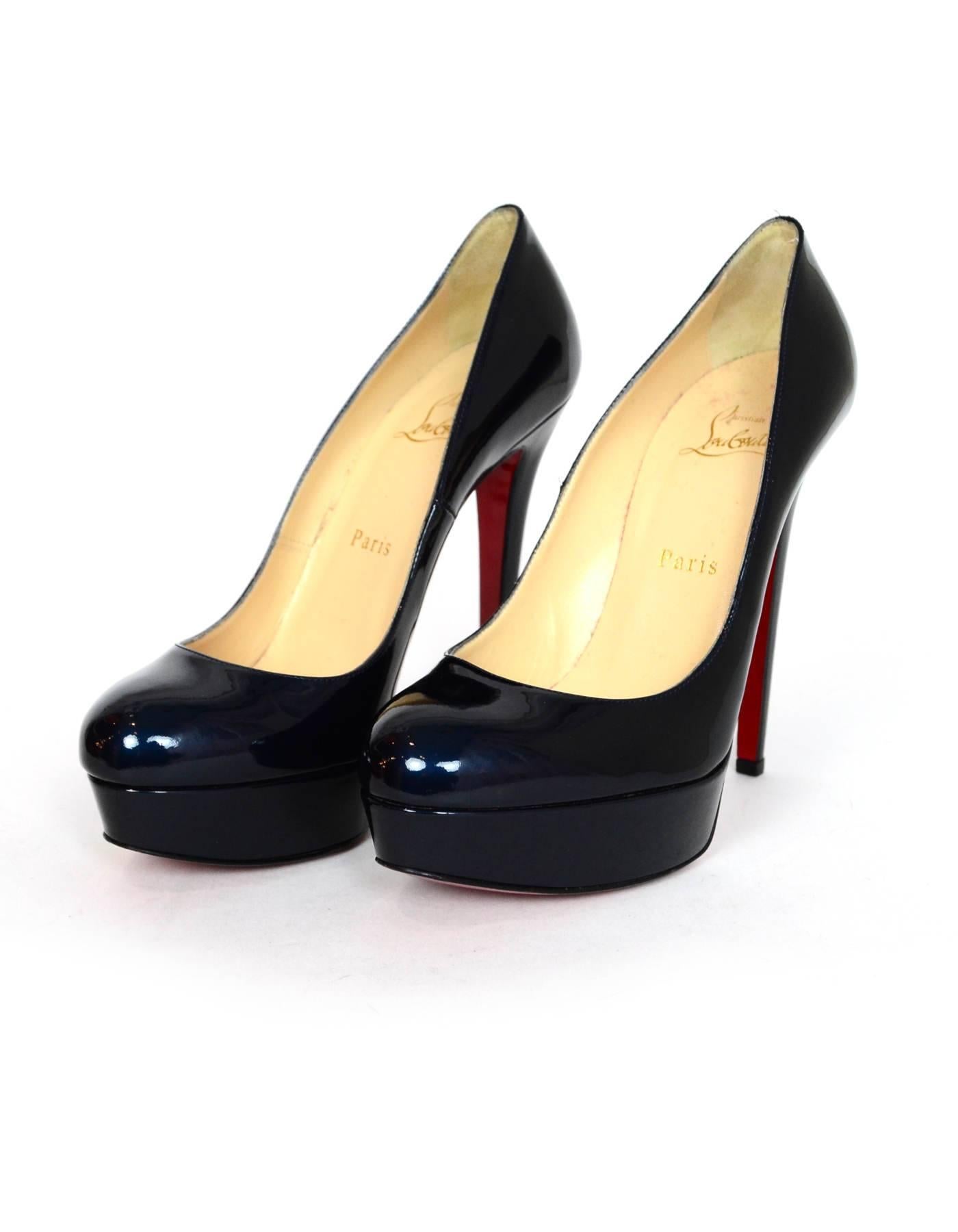 Christian Louboutin Dark Blue Patent Bianca 140mm Pumps Sz 38

Made In: Italy
Color: Dark blue
Materials: Patent leather
Closure/Opening: Slide on
Sole Stamp: Christian Louboutin Made in Italy 38
Retail Price: $875 + tax
Overall Condition: Excellent