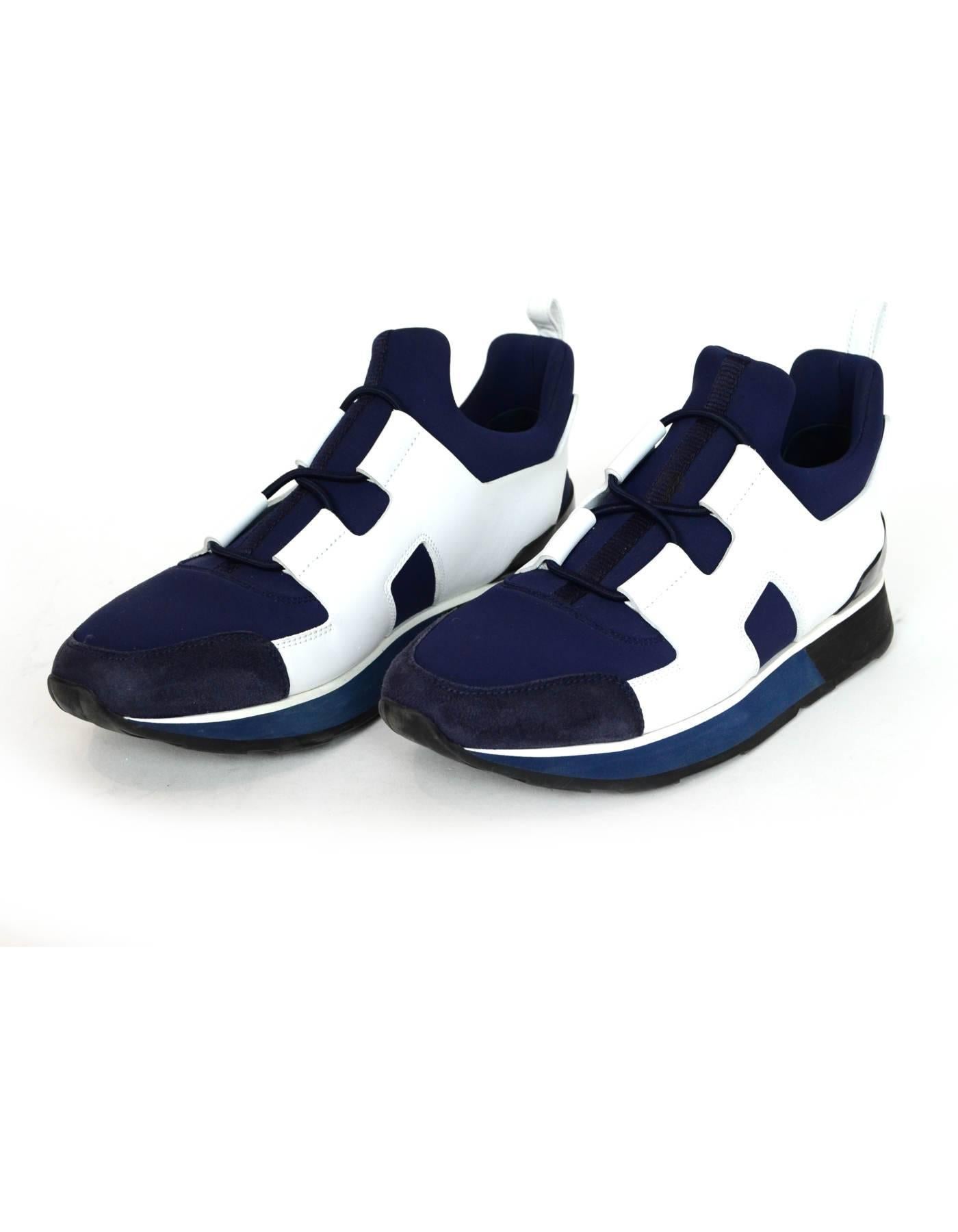 Hermes Marine, Blanc & Noir Technical Canvas & Leather H Player Sneakers Sz 37

Made In: Italy
Color: Navy, black, white
Materials: Canvas, calfskin leather, rubber
Closure/Opening: Slide on with elastic laces
Sole Stamp: Hermes Made in Italy
Retail