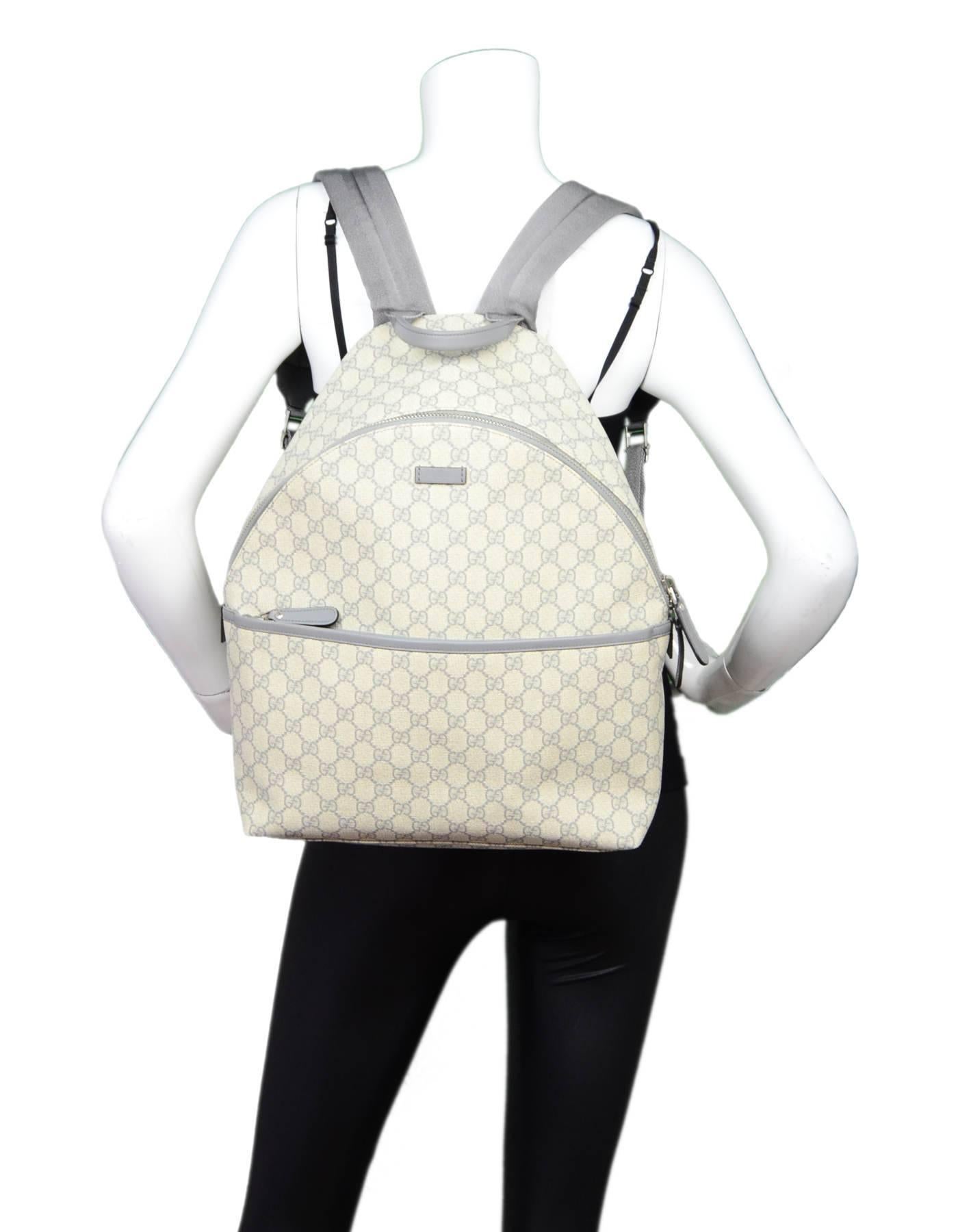 Gucci Monogram GG Supreme Backpack

Made In: Italy
Color: Cream, grey
Hardware: Silvertone
Materials: Coated canvas, leather
Lining: Beige canvas
Exterior Pockets: Front zip pocket
Interior Pockets: Two wall pockets, zip wall pocket
Serial