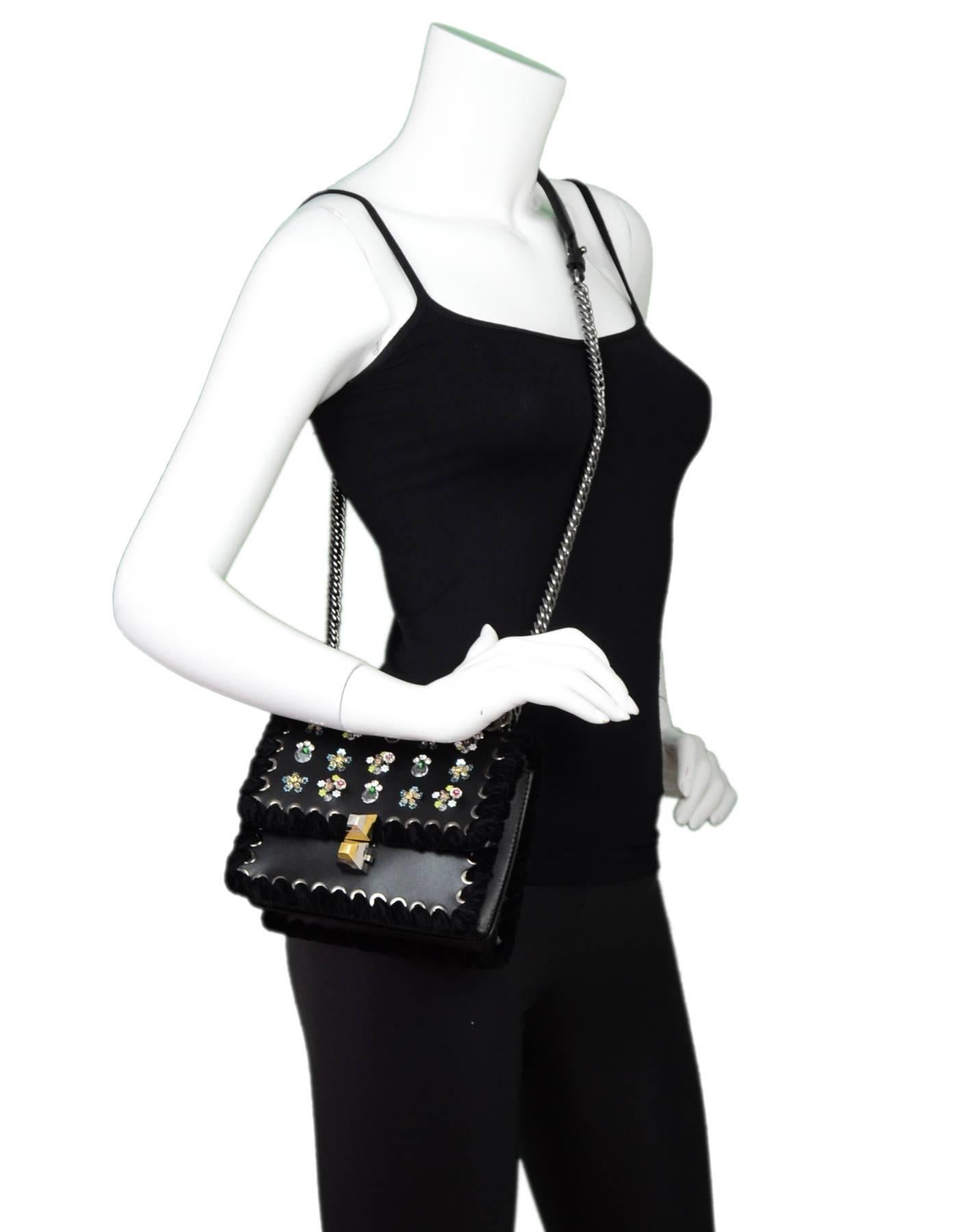 Fendi Black Leather Kan I Mini Whipstitch Stones Bag
Features calfskin leather, velvet whip-stitch and floral embroidery

Made In: Italy
Color: Black
Hardware: Silvertone
Materials: Leather, velvet
Lining: Black textile
Closure/Opening: Flap top