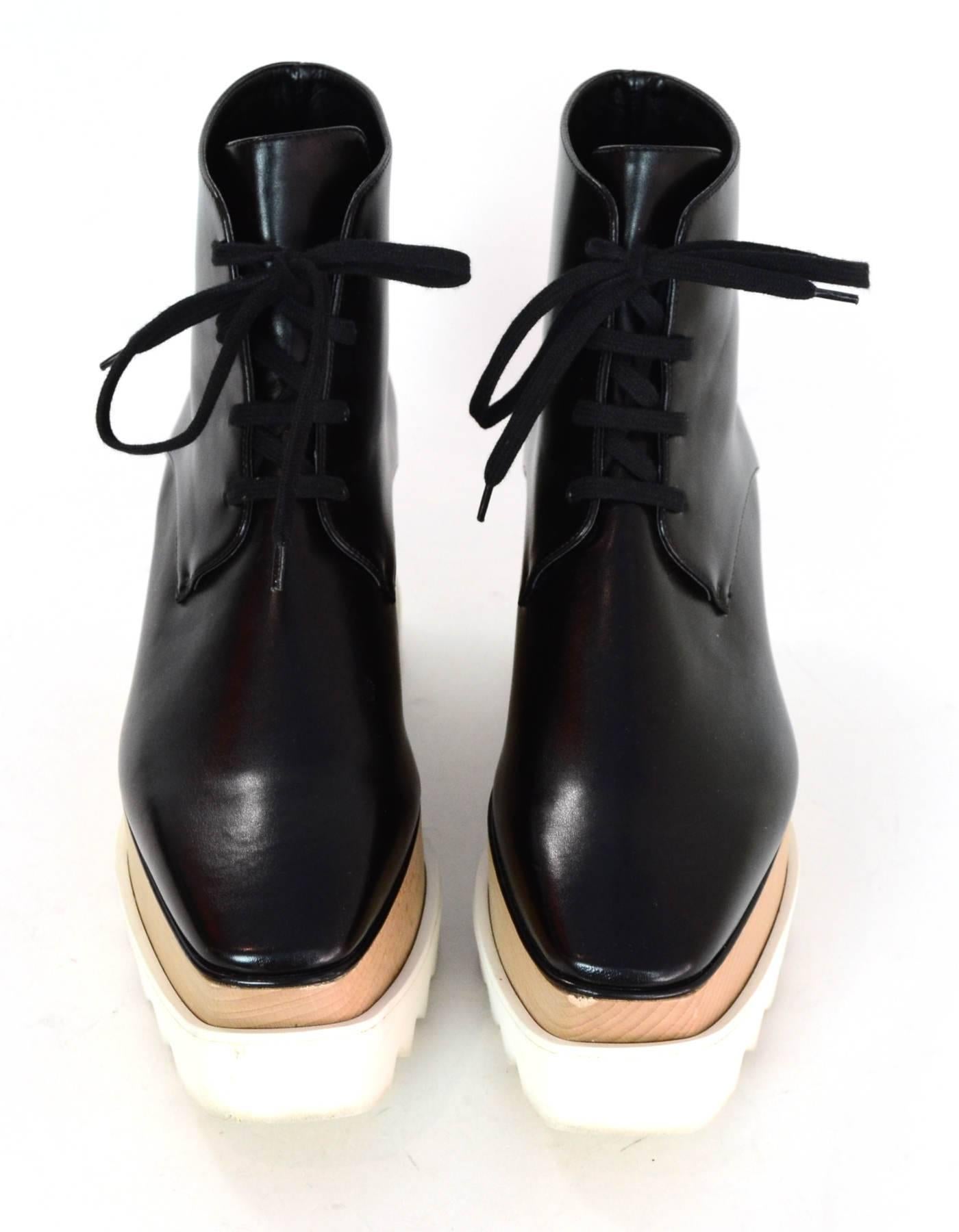 Stella McCartney Black Elyse Vegan Glossed Leather Boots Sz 38.5

Made In: Italy
Color: Black
Materials: Glossed vegan leather, rubber
Closure/Opening: Lace tie closure
Sole Stamp: Stella McCartney 38.5
Retail Price: $840 + tax
Overall Condition: