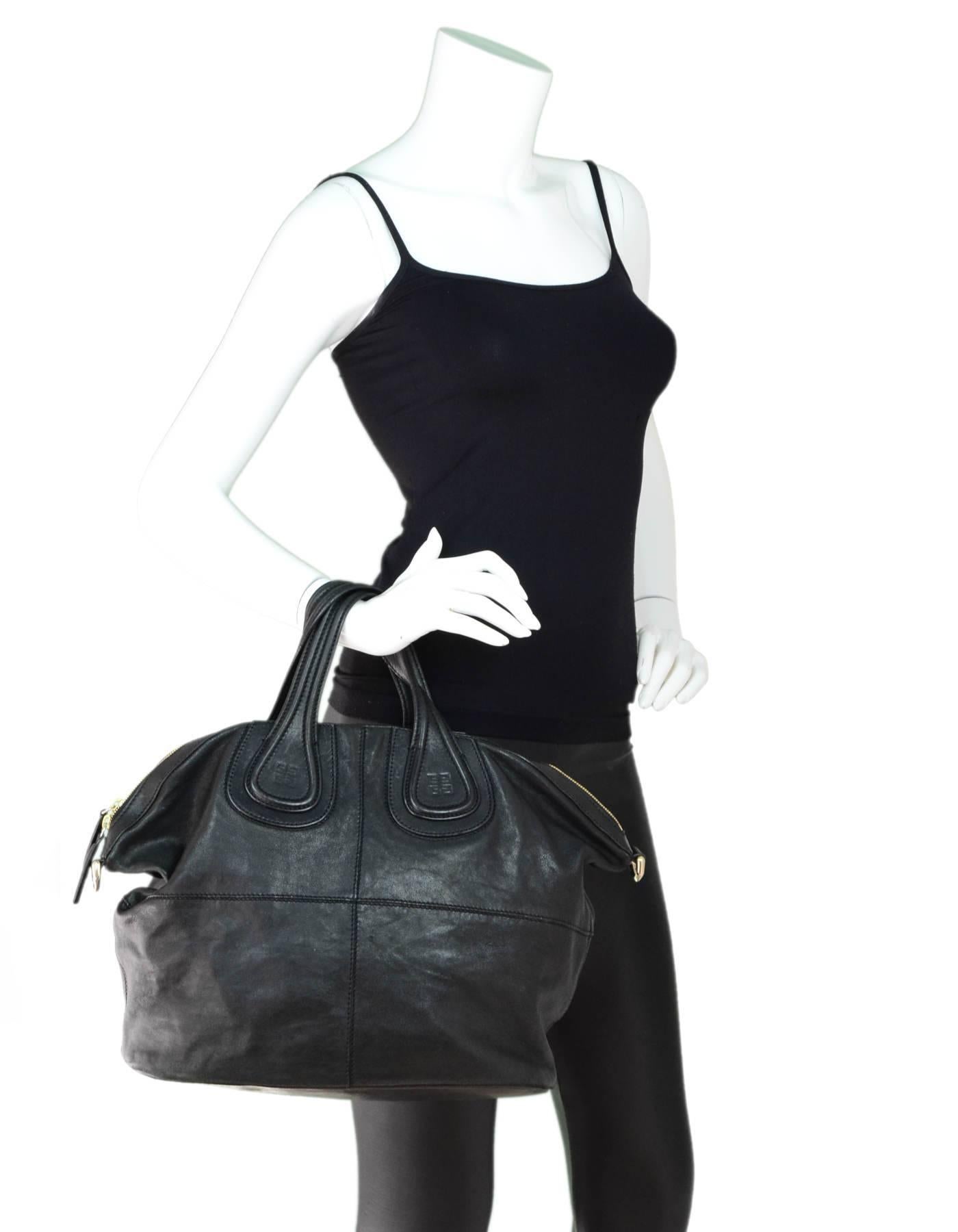 Givenchy Black Leather Medium Nightingale Tote
*Missing shoulder strap*

Made In: Italy
Color: Black
Hardware: Goldtone
Materials: Leather, metal
Lining: Black textile
Closure/Opening: Double zip top closure
Exterior Pockets: None
Interior Pockets:
