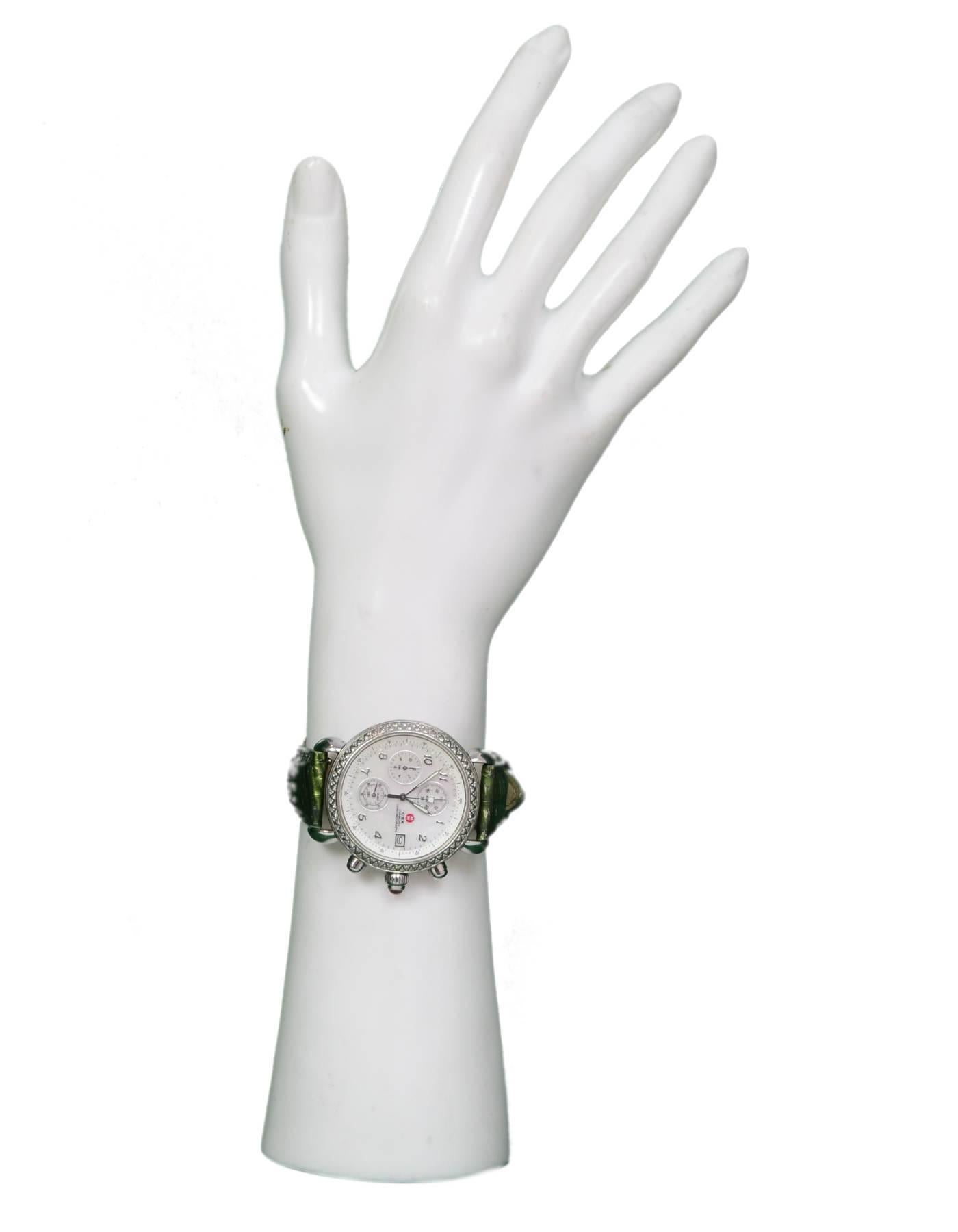 Michele Stainless Steel & Diamonds CSX Watch
Features mother of pearl face and comes with extra straps

Made In: Japan
Color: Silver, multi
Materials: Stainless steel, mop, diamonds
Closure/Opening: Butterfly clasp and buckle closure
Movement: