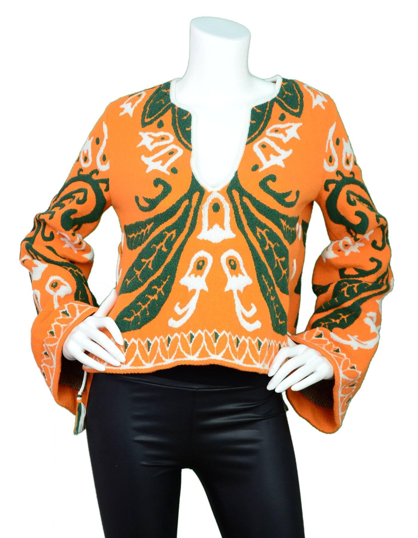 Emilio Pucci Orange Bell Sleeve Top Sz S

Features lace-up sides

Made In: Italy
Color: Orange, green, white
Composition: 80% cotton, 20% polyamide
Lining: None
Closure/Opening: Pullover
Overall Condition: Excellent pre-owned condition
Inclued:
