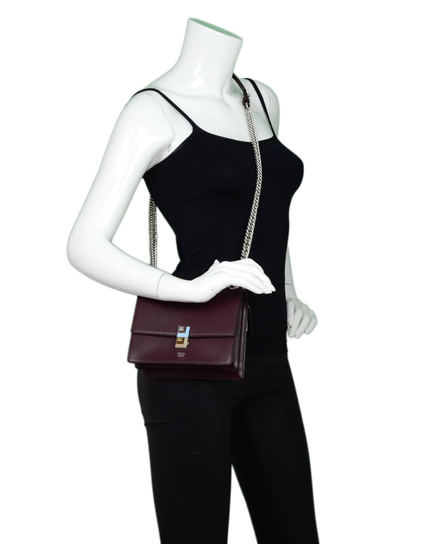 Fendi Burgundy Leather Kan I Small Shoulder Bag
Can be worn as a crossbody or shoulder bag

Made In: Italy
Color: Burgundy
Hardware: Silvertone
Materials: Leather, metal
Lining: Burgundy suede
Closure/Opening: Flap top with side push-lock
Exterior