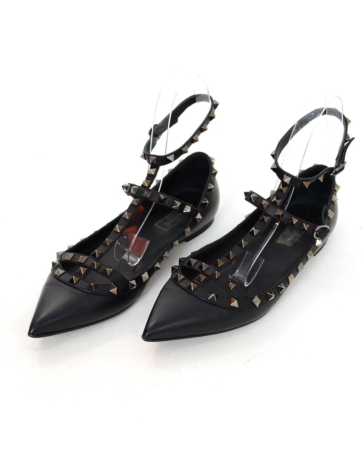 Valentino Noir Leather Rockstud Flats Sz 40.5

Made In: Italy
Color: Black
Materials: Leather, metal
Closure/Opening: Ankle strap with buckle closure
Sole Stamp: Valentino Garavani Made in Italy 40.5
Overall Condition: Excellent pre-owned condition