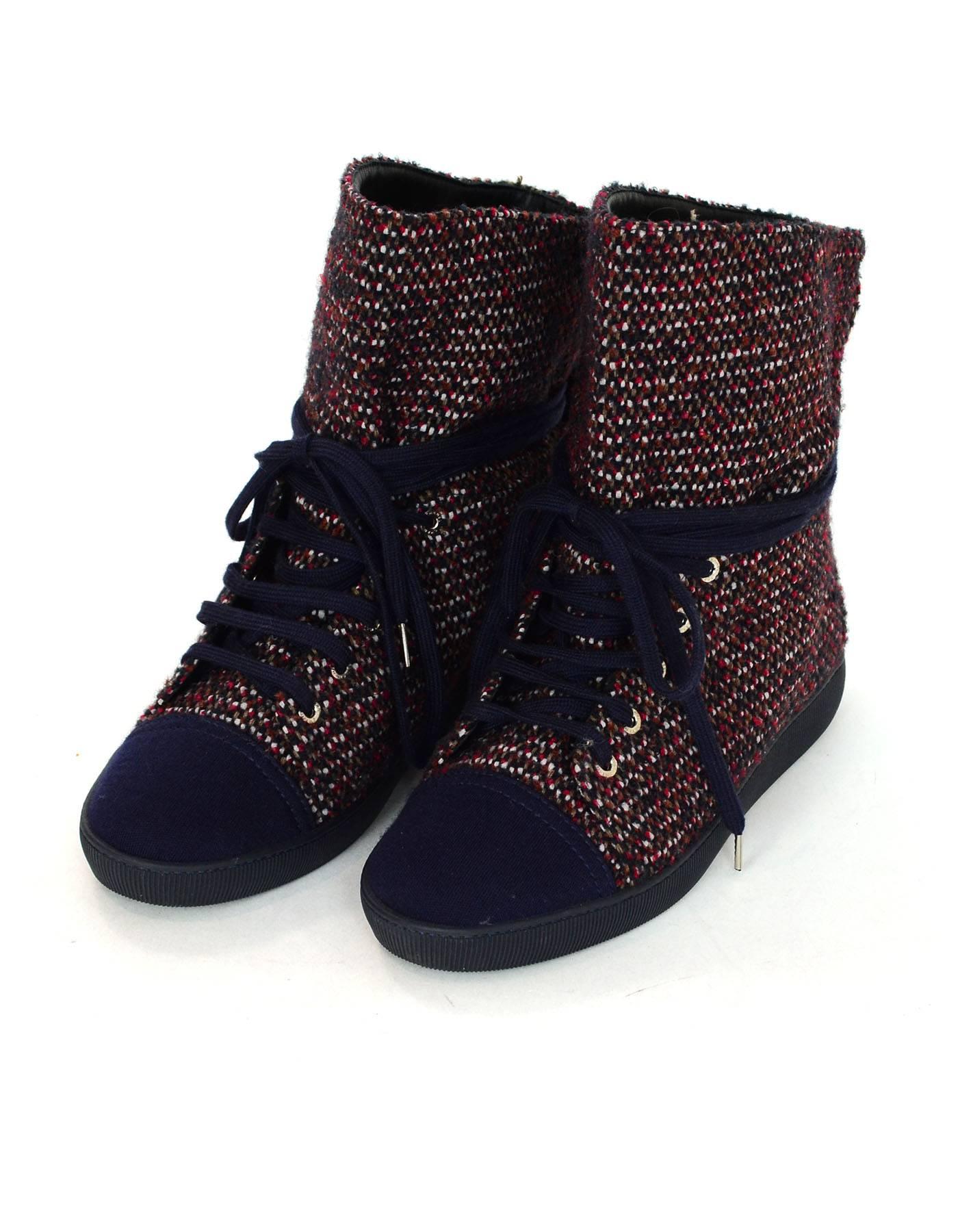 Chanel Red & Blue Tweed Cap-Toe Sneaker Boots Sz 38

Made In: Italy
Color: Red, blue
Materials: Tweed, leather, rubber
Closure/Opening: Lace tie closure
Sole Stamp: Chanel made in Italy
Overall Condition: Excellent pre-owned condition with the