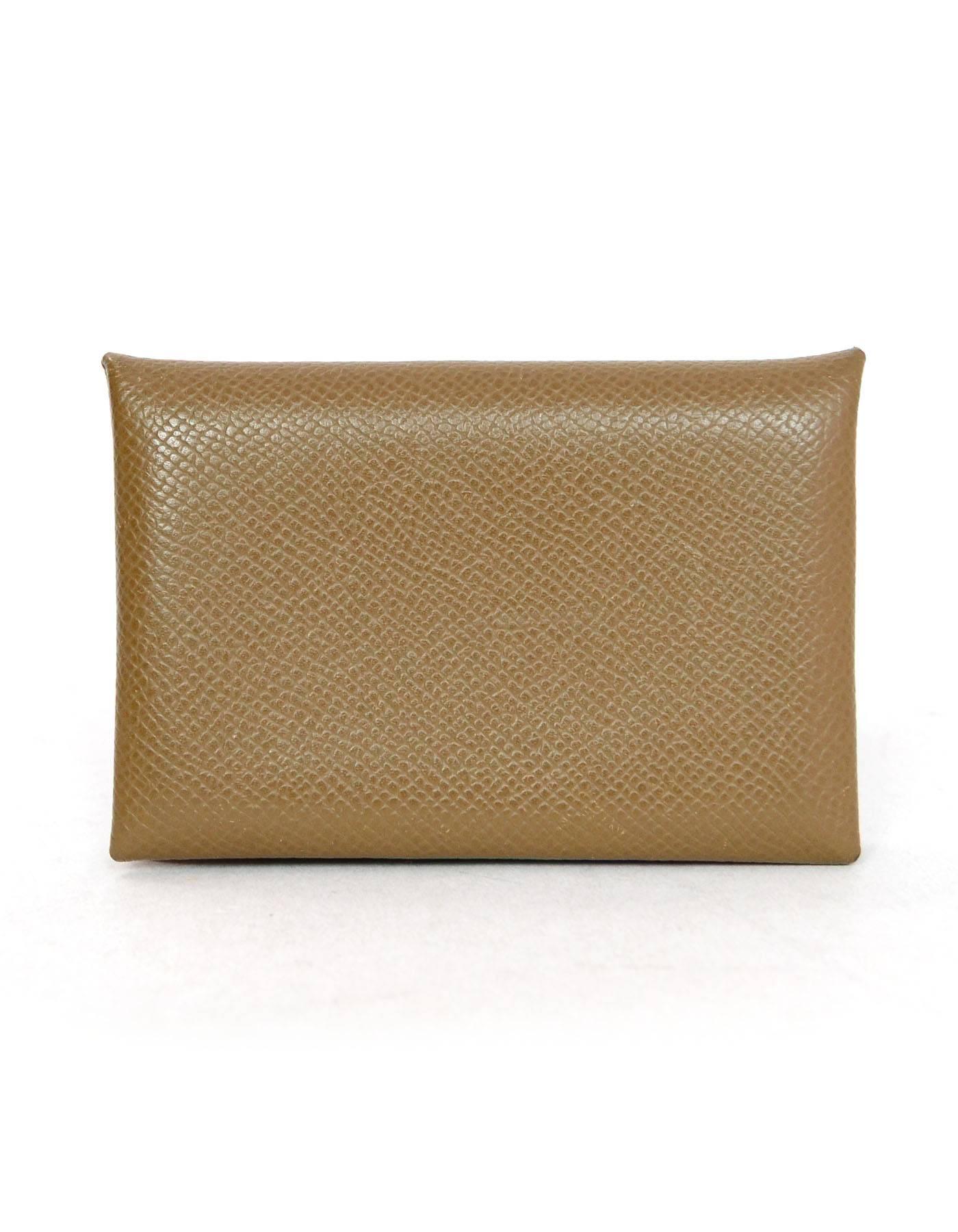 Hermes Taupe Epsom Calfskin Calvi Card Holder

Made In: France
Color: Taupe
Year Of Production: 2009
Materials: Epsom leather
Closure/Opening: Bi-fold with snap
Stamp / Date Code: M in square
Retail Price: $335 + tax
Overall Condition: Excellent