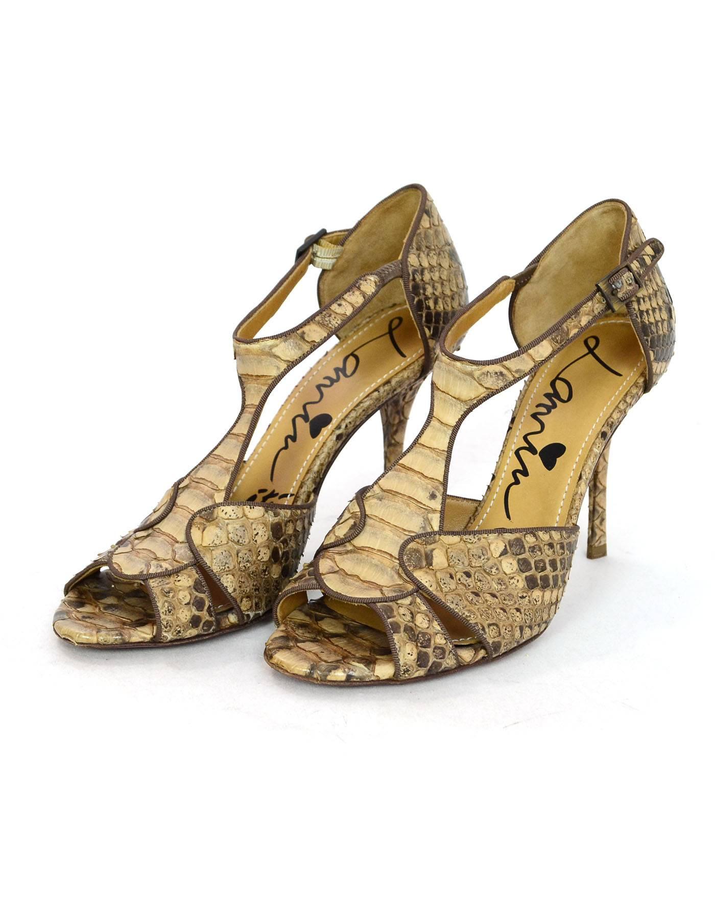 Lanvin Tan Python T-Strap Sandals Sz 38

Made In: Italy
Color: Tan
Materials: Python
Closure/Opening: Buckle closure at ankle
Sole Stamp: Vero cuoio made in italy 38
Overall Condition: Excellent pre-owned, some wear at outsoles
Marked Size: 38
Heel
