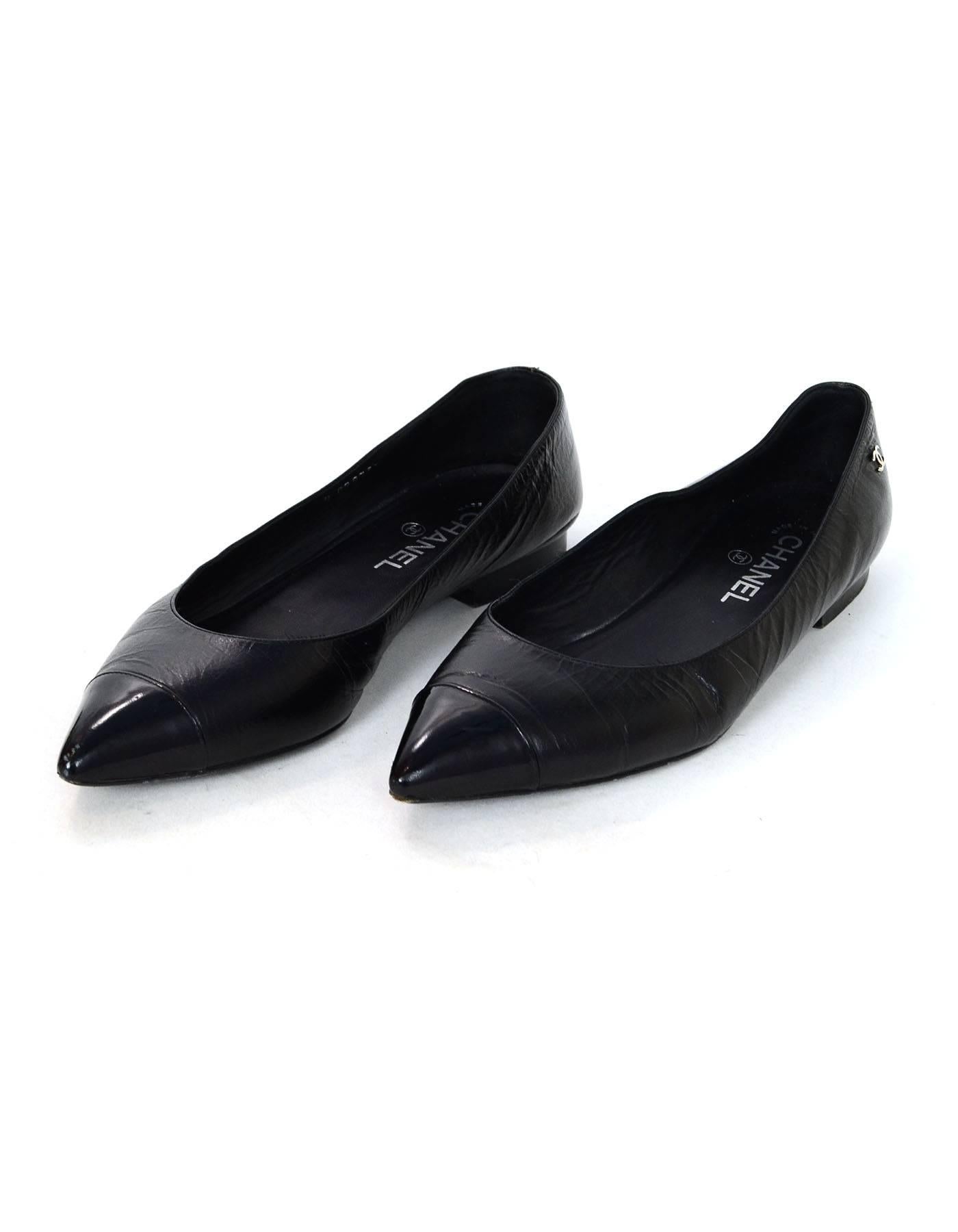 Chanel Black Leather & Patent Cap-Toe Flats Sz 40.5

Made In: Italy
Color: Black
Materials: Leather, patent leather
Closure/Opening: Slide on
Sole Stamp: CC Made in Italy 40.5
Overall Condition: Very good pre-owned condition with the exception of