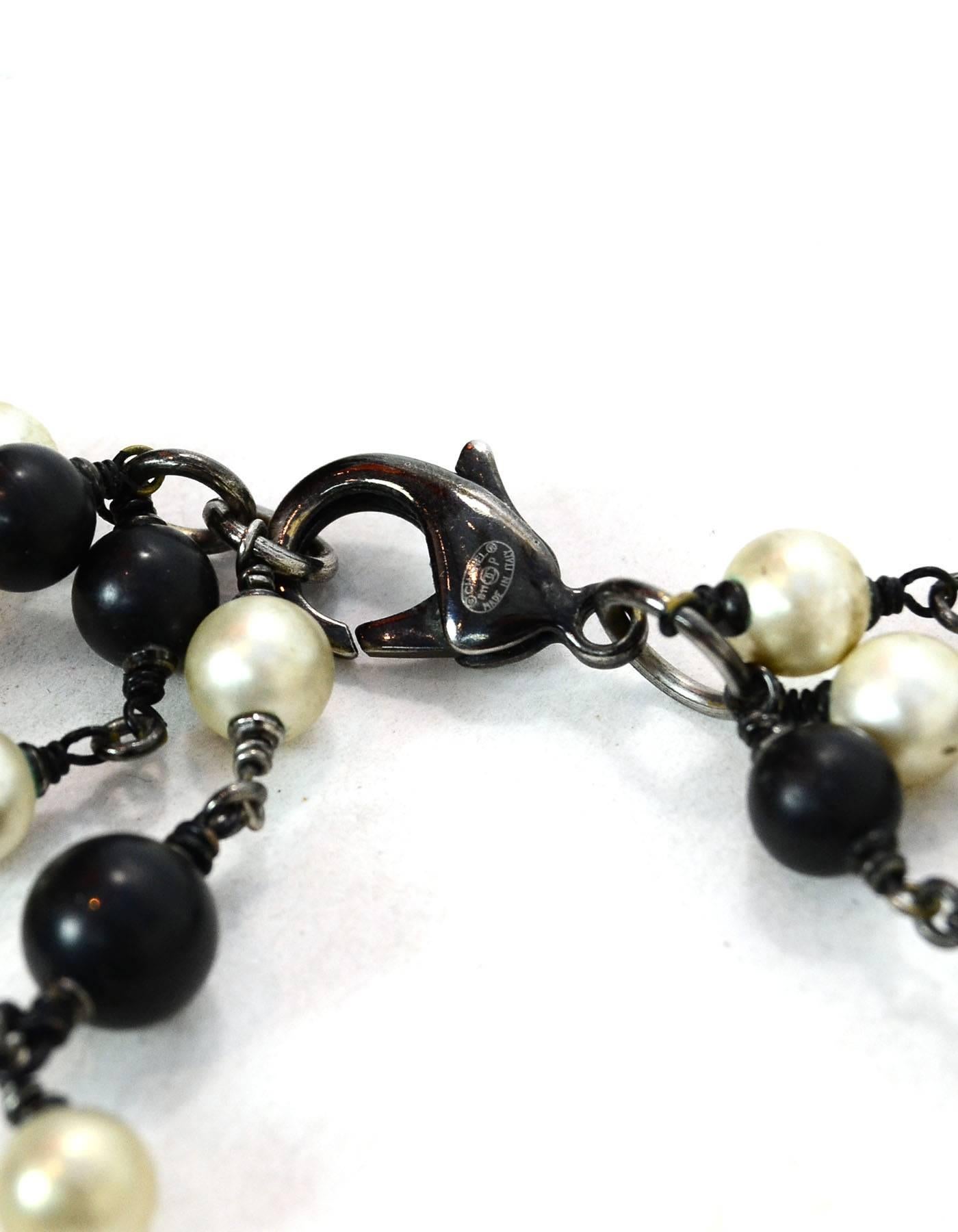 Chanel 2011 Black Bead & Ivory Faux Pearl CC Three-Strand Necklace In Excellent Condition In New York, NY