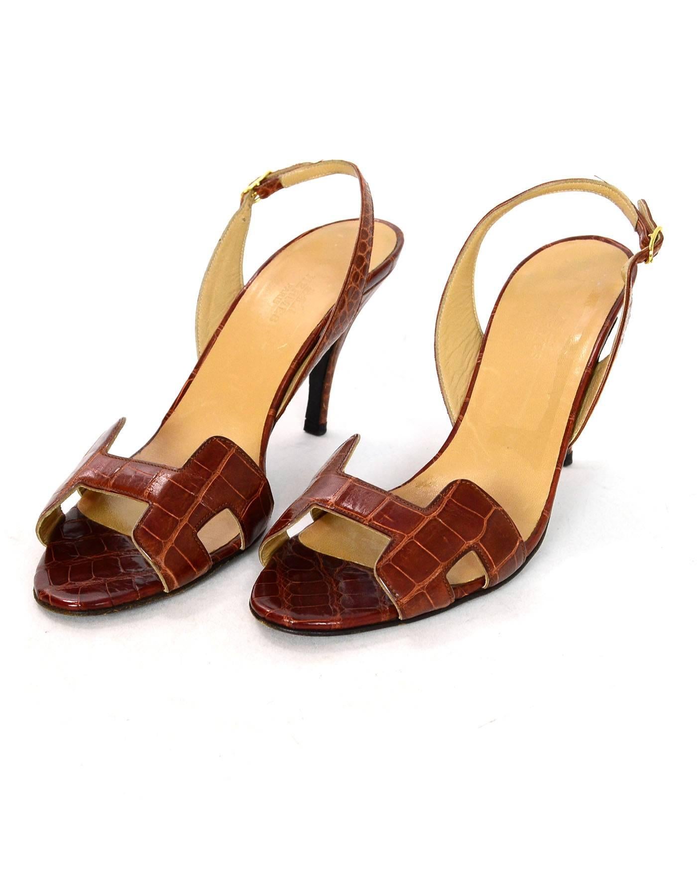 Hermes Cognac Crocodile H Night Sandals Sz 38

Made In: Italy
Color: Brown
Materials: Crocodile
Closure/Opening: Slinback strap
Sole Stamp: Hermes 38 Semelle Cuir Made in Italy
Overall Condition: Excellent pre-owned condition with the exception of