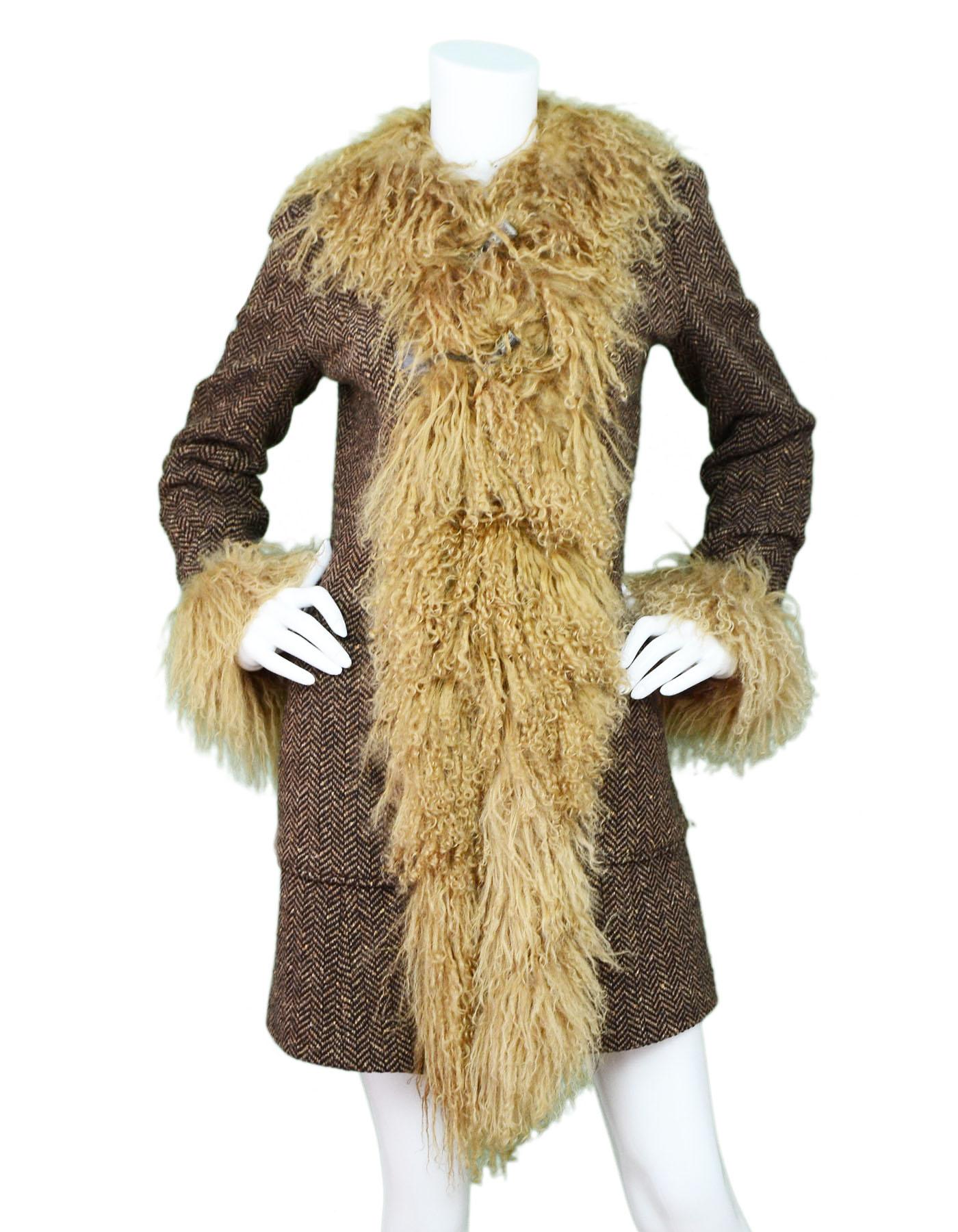 D&G Brown Wool Herringbone & Mongolian Fur Coat Sz IT40

Made In: Italy
Color: Brown
Composition: 90% wool, 10% nylon
Lining: Brown print textile
Closure/Opening: Front toggle closure
Exterior Pockets: Patch pockets at hips
Overall Condition: