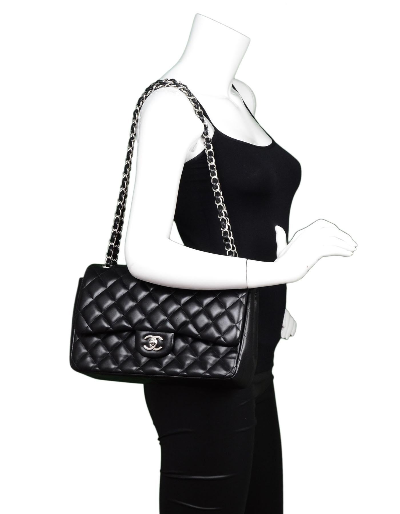 Chanel Black Quilted Lambskin Jumbo Double Flap Bag 

Made In: Italy
Year of Production: 2012
Color: Black
Hardware: Silverotne
Materials: Lambskin leather, metal
Lining: Burgundy leather
Closure/opening: Double flap top with snap closure and CC