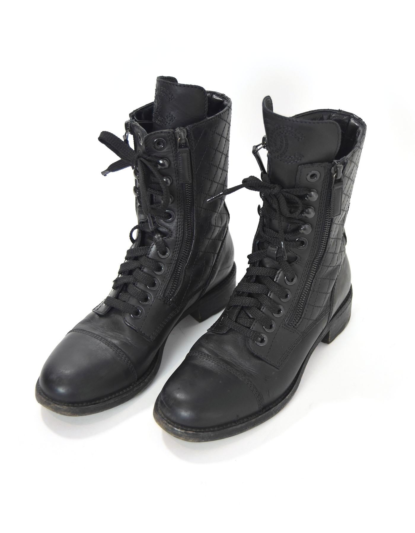 Chanel Black Quilted Leather Combat Boots Sz 38.5

Made In: Italy
Color: Black
Materials: Leather
Closure/Opening: Lace tie and zip closure
Sole Stamp: Chanel Made in Italy 38.5
Overall Condition: Excellent pre-owned condition with the exception of